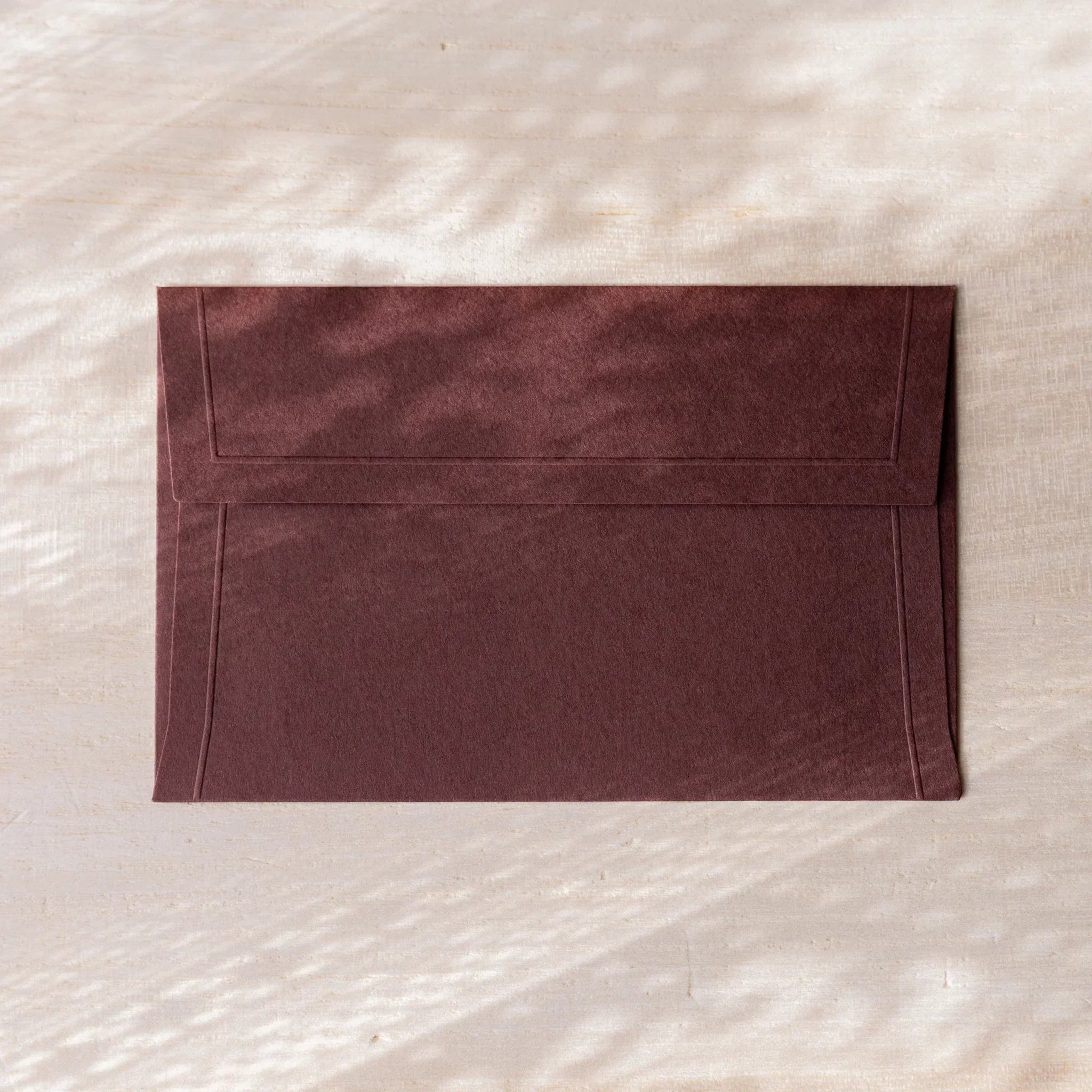 Dressco envelope, yellow shade, fanned display showing paper quality detail