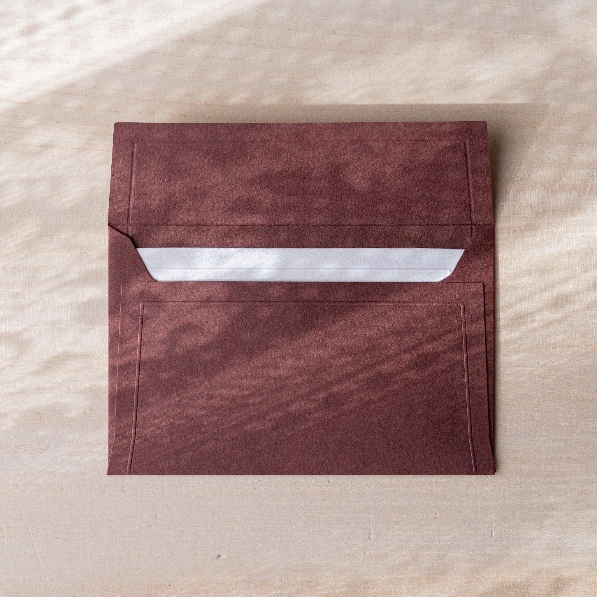 Dressco embossed envelope, teal, product view displaying textured finish