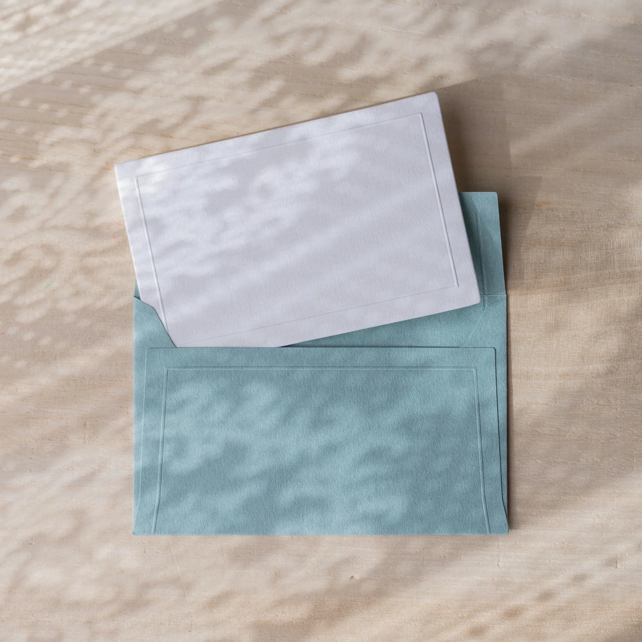 Dressco embossed small envelope in white, fanned arrangement textured surface