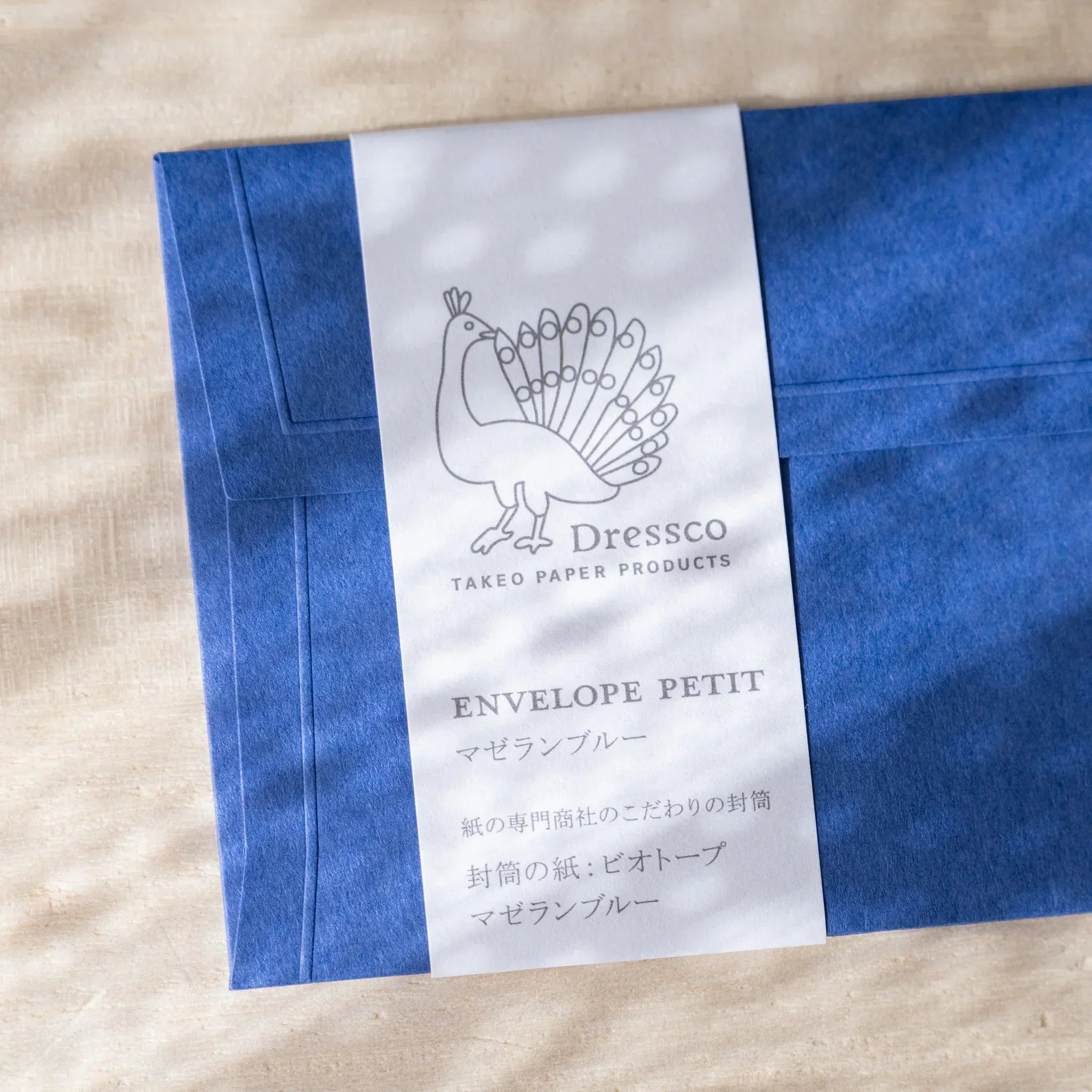 Dressco embossed envelope, sage green shade, flat lay displaying surface finish