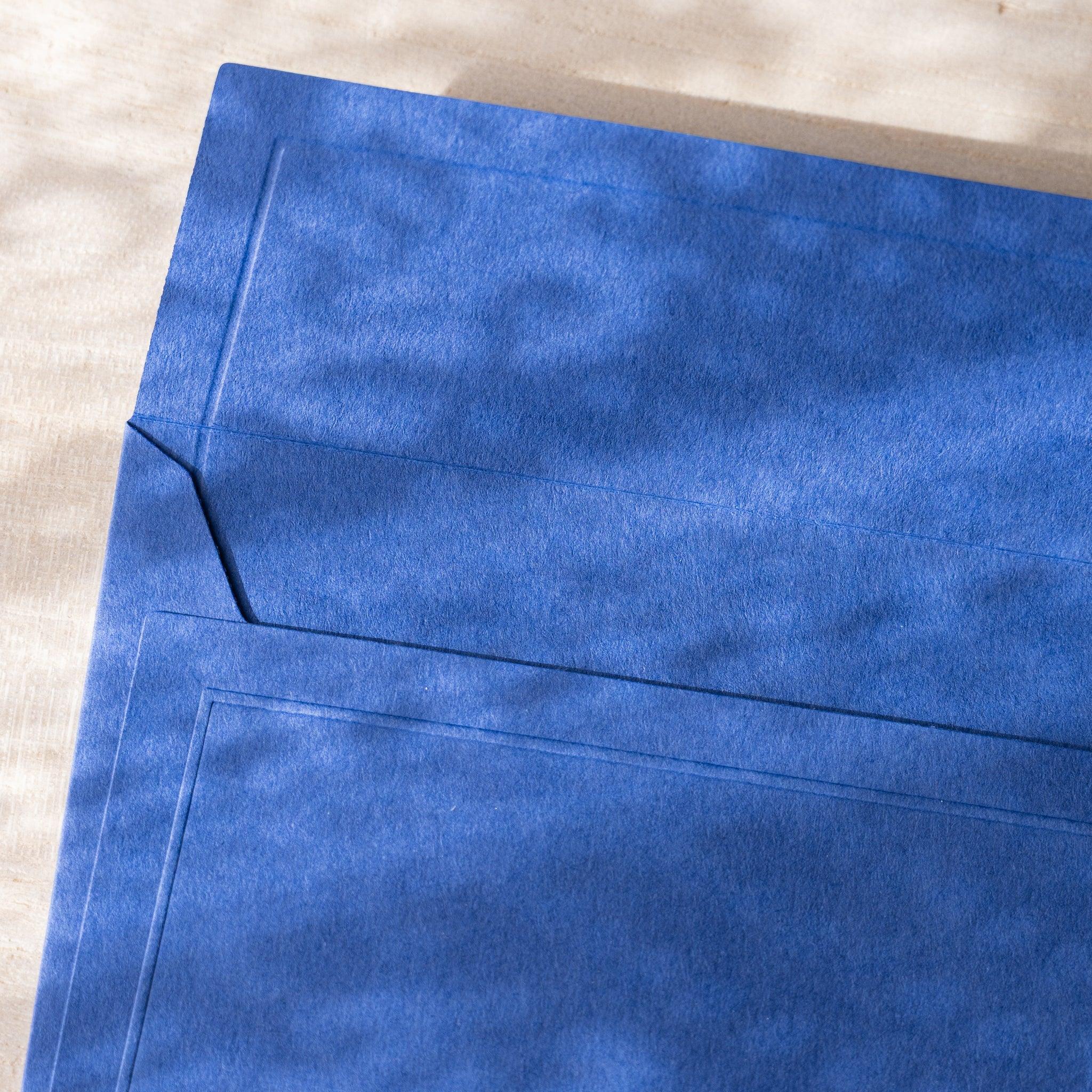 Dressco envelope collection, soft toned shade, angled view highlighting texture