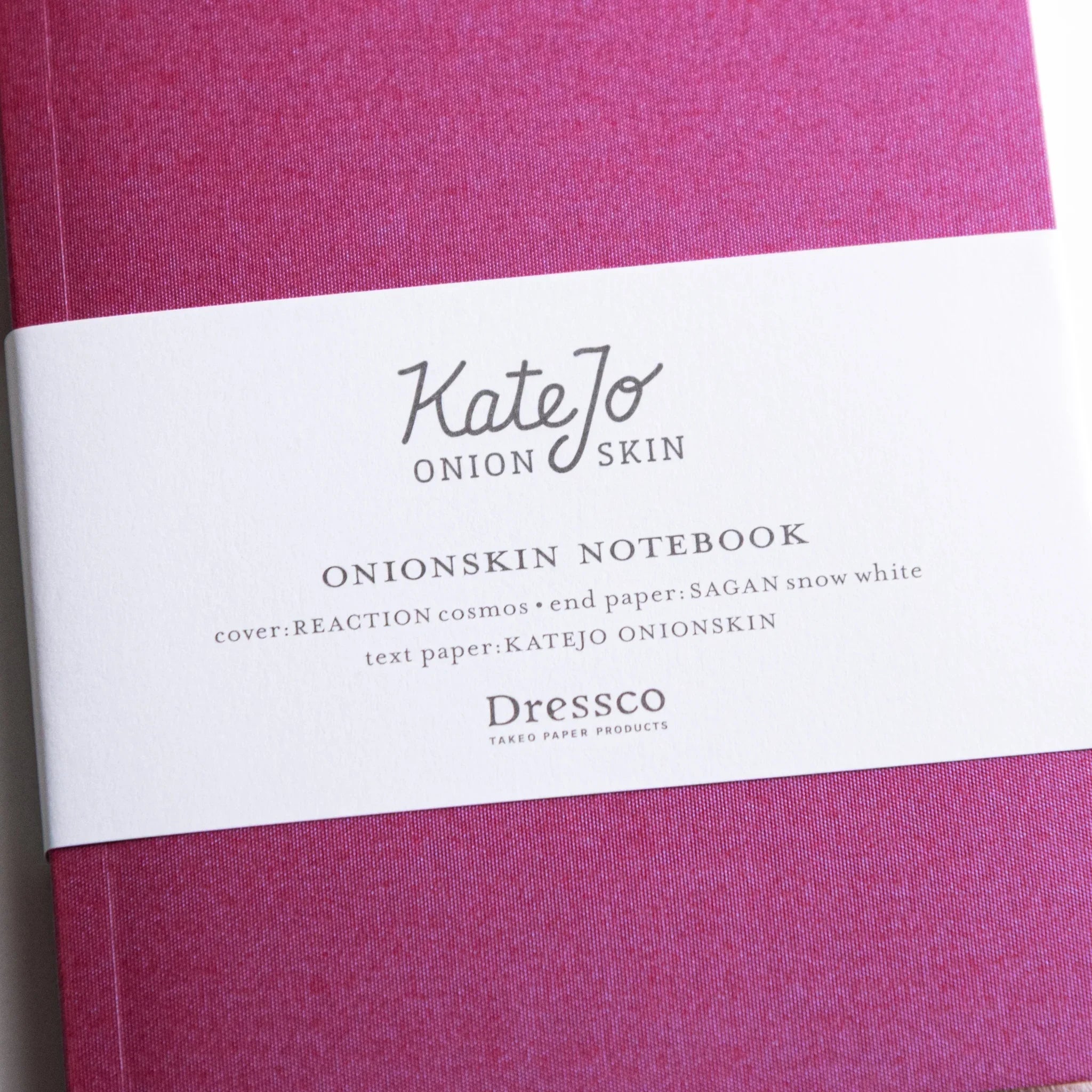 Close-up of Dressco Pink Onion Skin Japanese Notebook A6 showing texture and printed label.