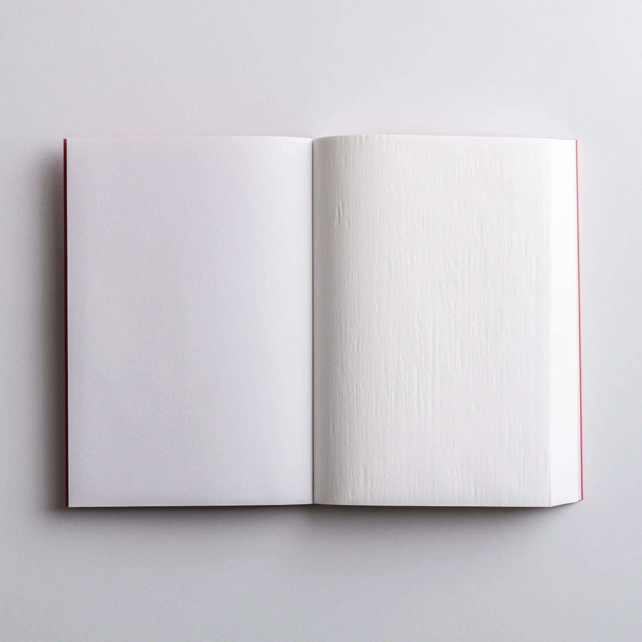 Open pages of Dressco Pink Onion Skin Japanese Notebook A6 showing smooth, crisp onion-skin texture.