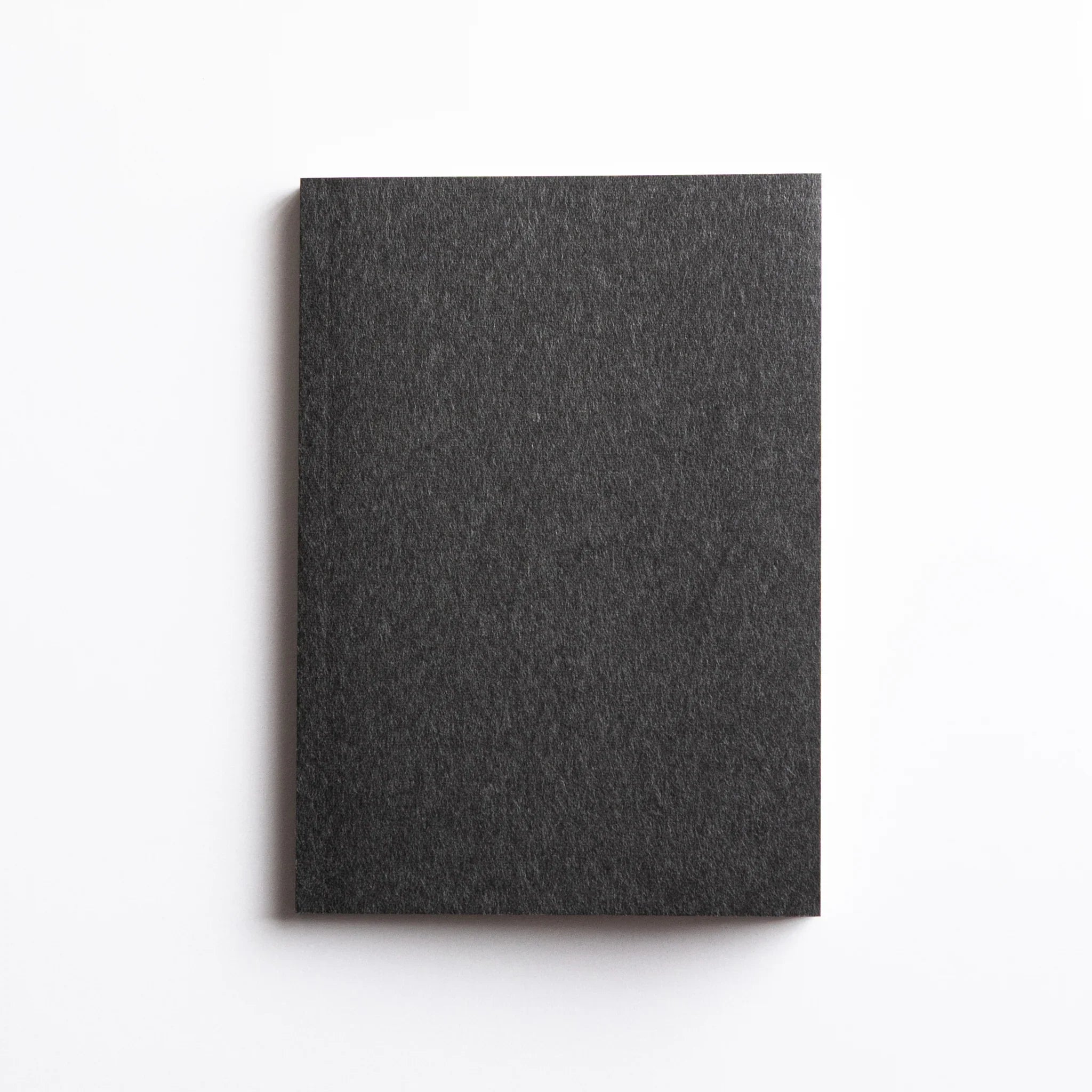 Front cover of Dressco Gray Onion Skin Japanese Notebook A6 in deep sumi gray tone.