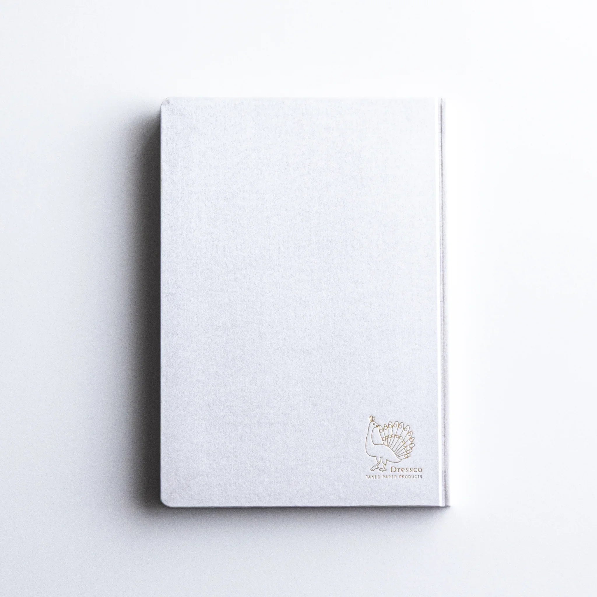 Top-down perspective of Dressco Spica Laid Bond Paper A6 notebook showing full cover design from directly above