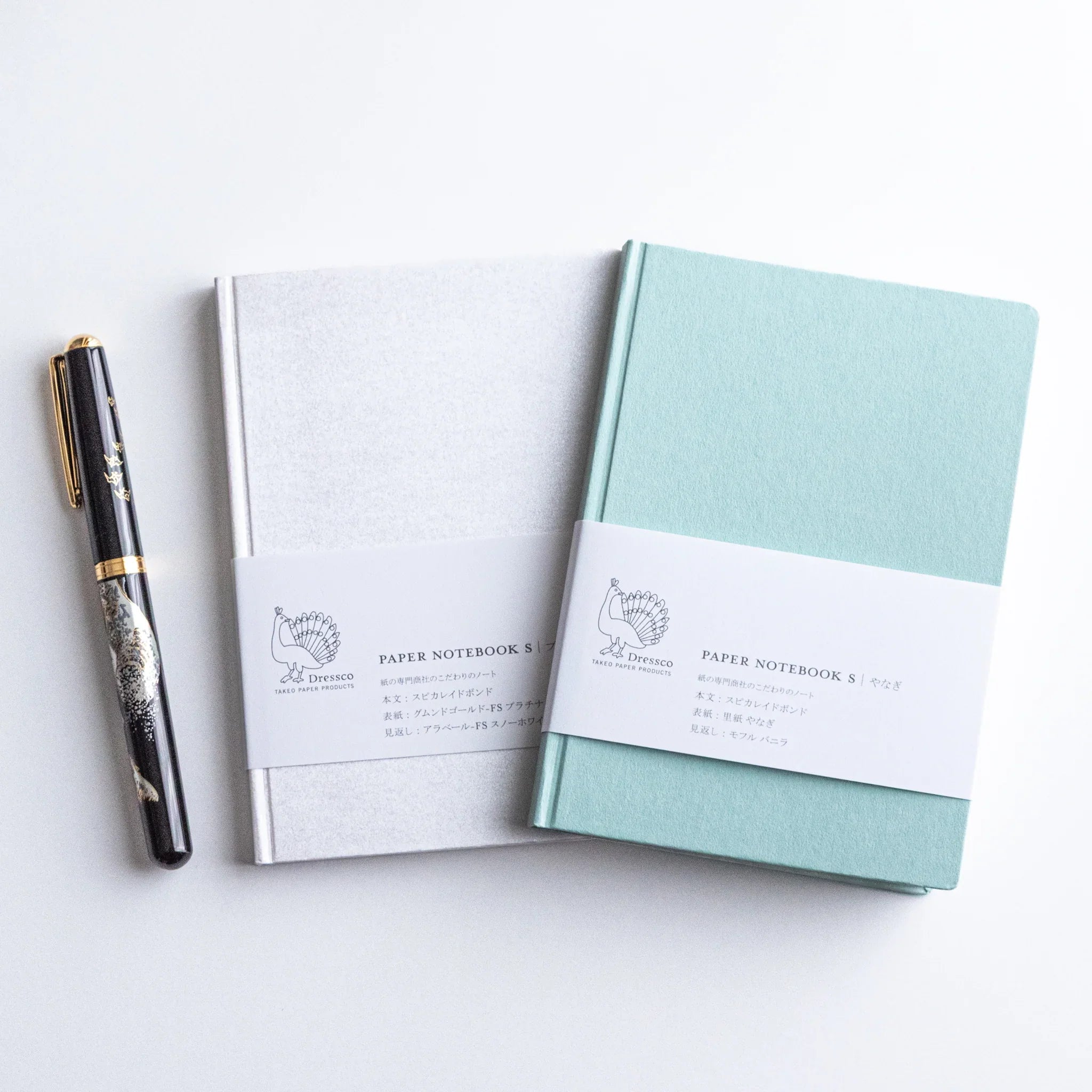 Dressco Spica Laid Bond Paper Japanese Notebooks with a Japanese Fountain Pen beside them.