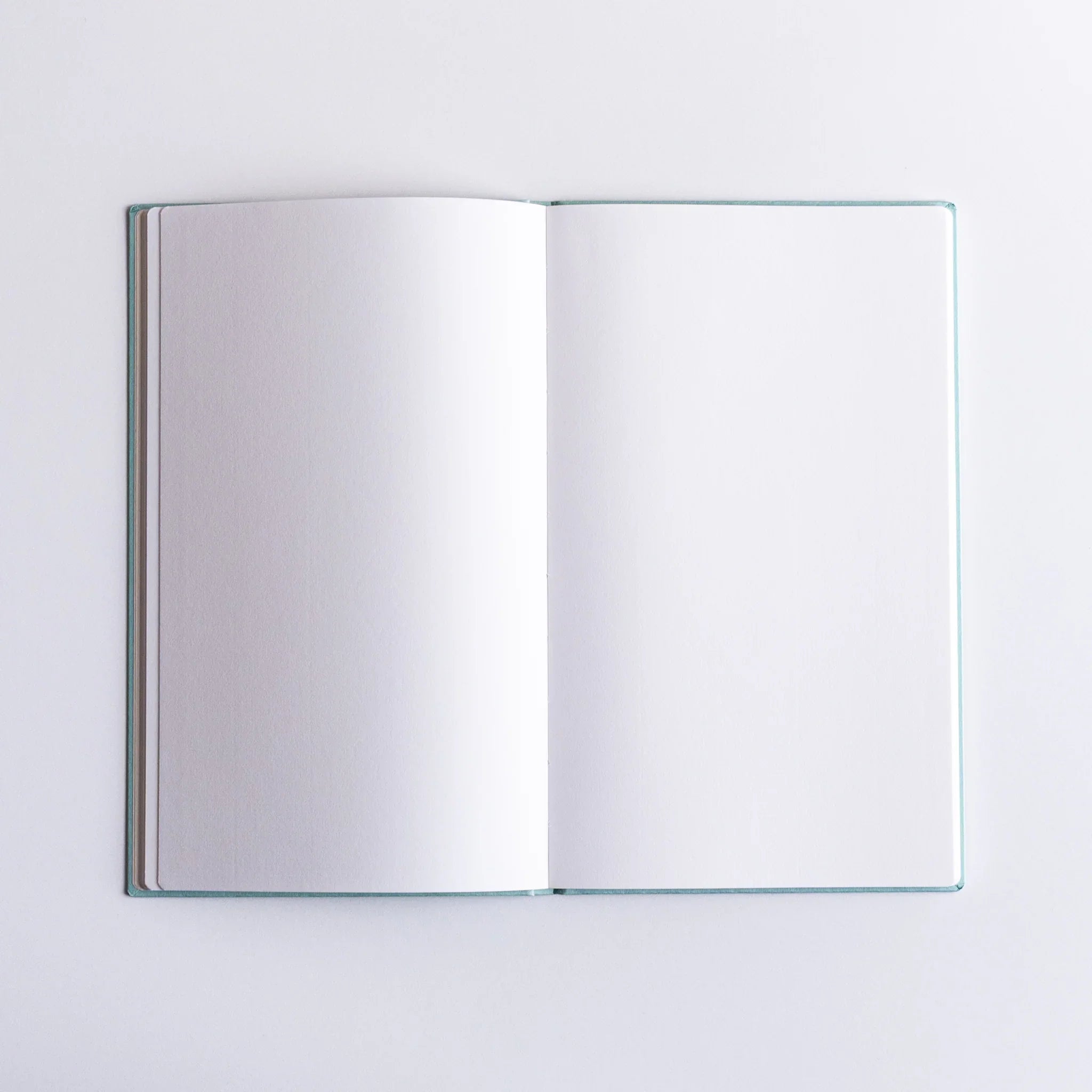 Dressco Spica Laid Bond Paper B6 notebook displayed standing upright showing its front cover design and proportions