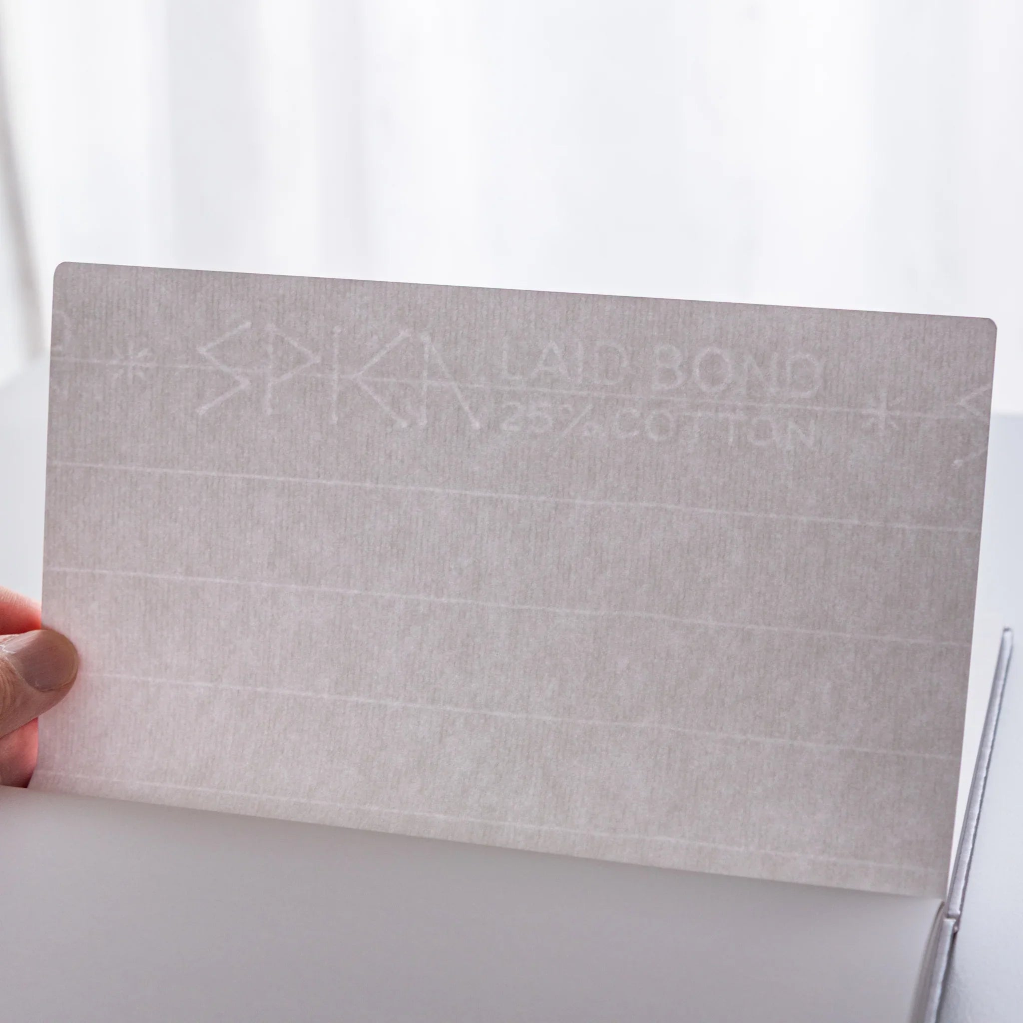 Dressco Spica Laid Bond Paper B6 notebook variants shown at angle revealing the range of cover colors available