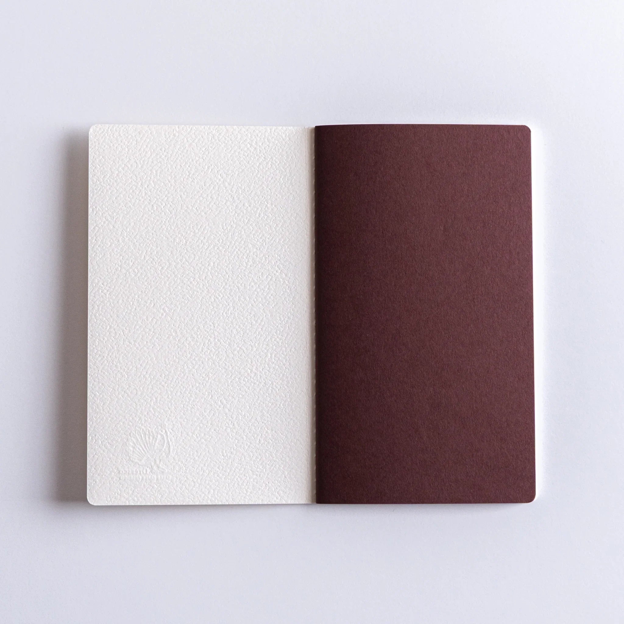 Dressco Spica Laid Bond Stitched A6 Japanese notebook front cover showing the cover design and compact A6 format