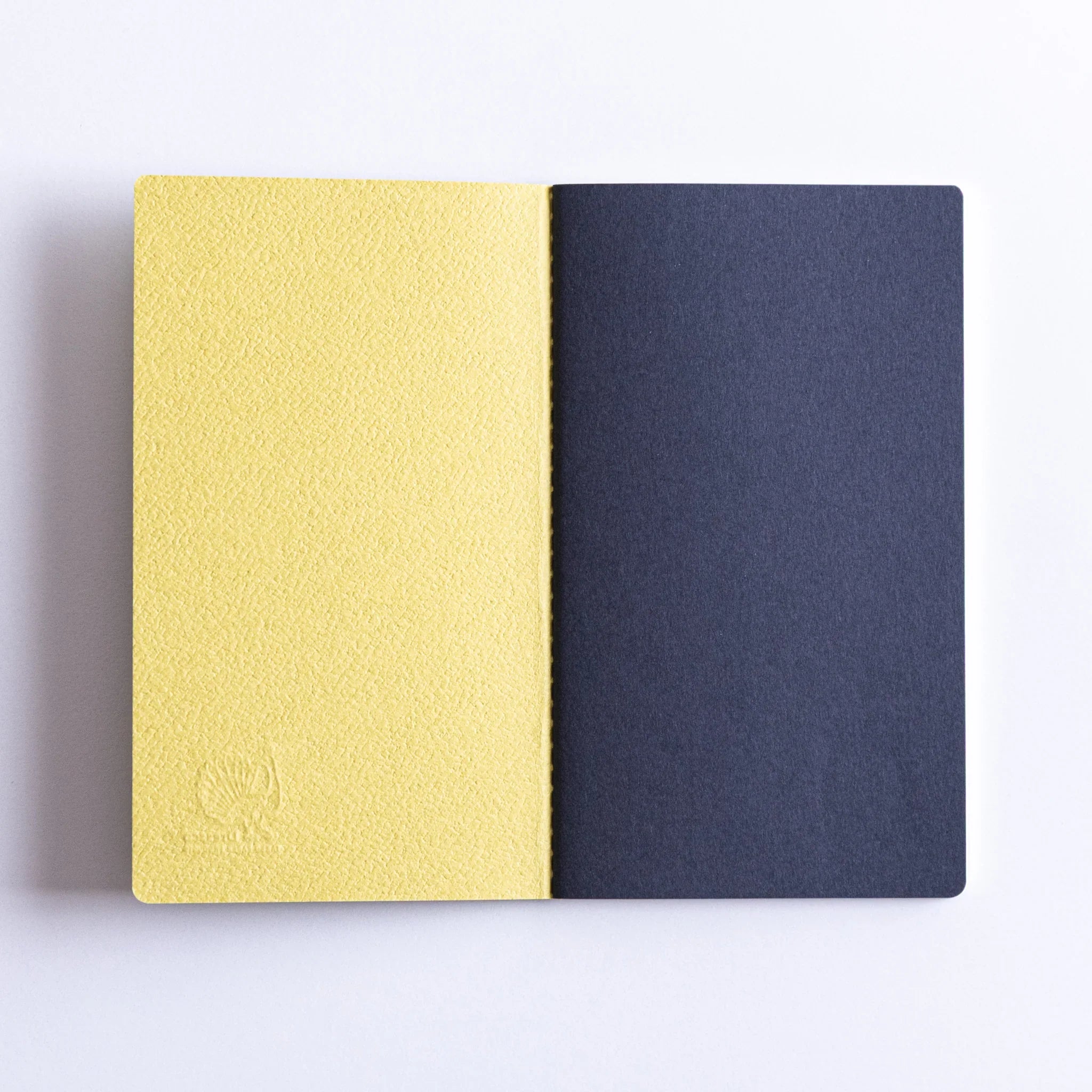 Inside cover view of Dressco Spica Laid Bond Japanese Notebook – Avocado and dark blue inner.