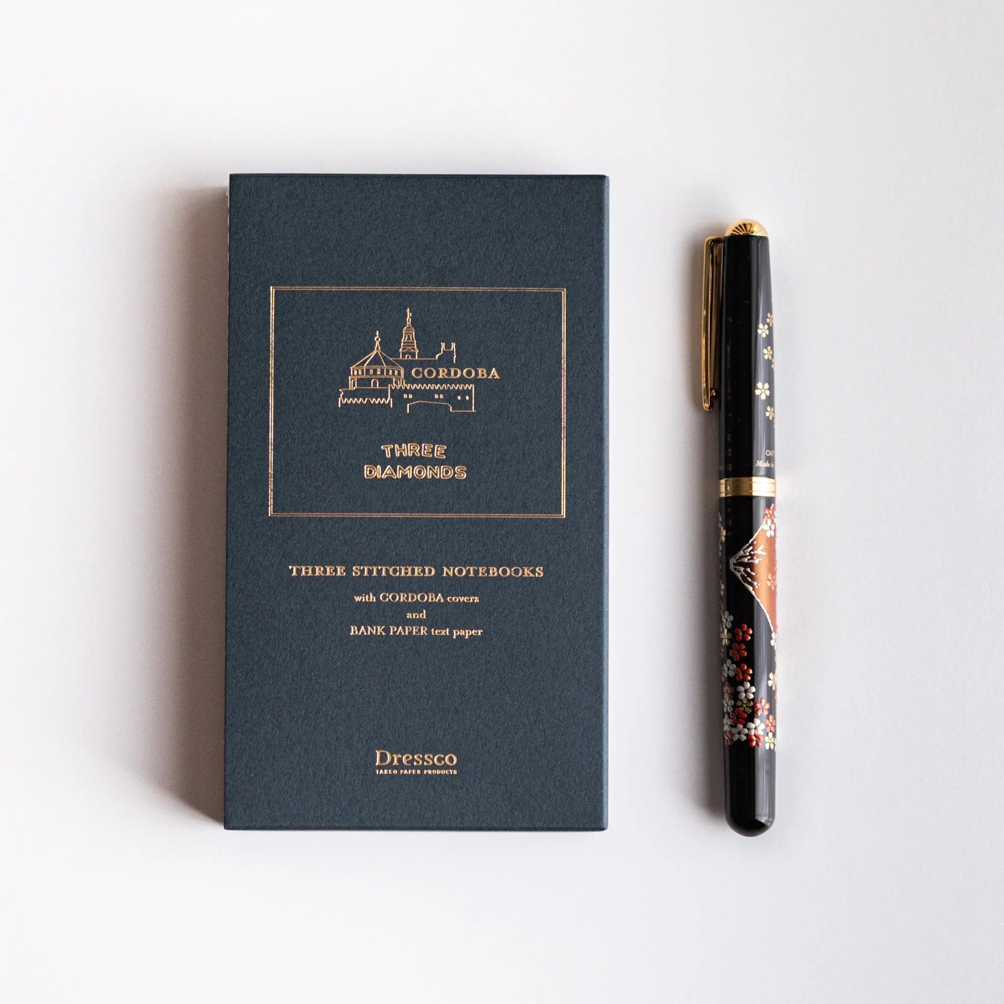 Dark blue Cordoba case with decorative fountain pen containing Japanese notebooks made from Bank Ledger Paper.