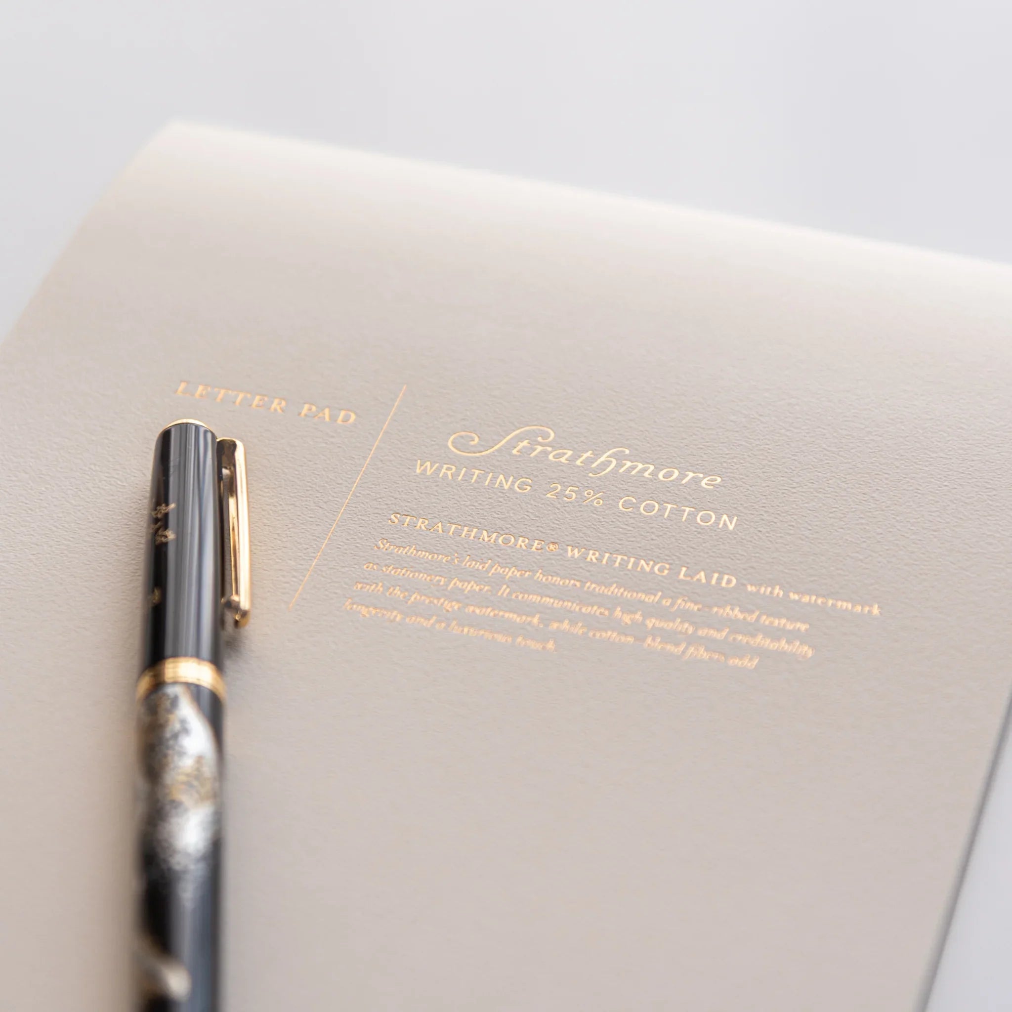 Japanese writing pad Strathmore Writing Laid N with fountain pen and golden lettering on grey cover