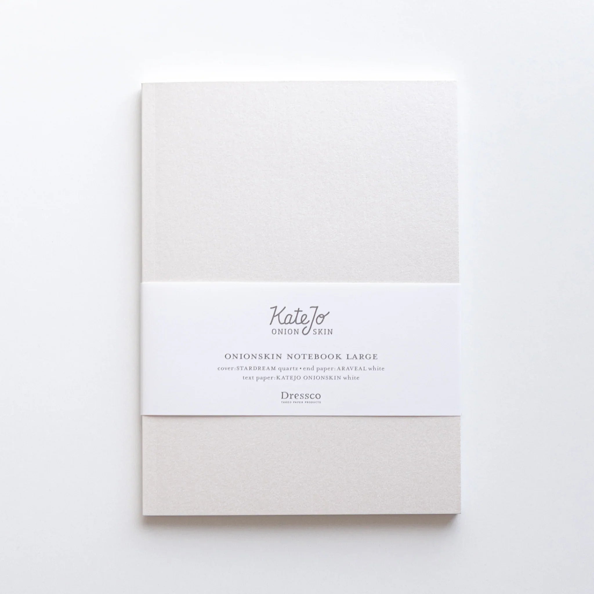 KateJo Onion Skin white B6 notebook with text information bands and Dressco branding on cover composition shown