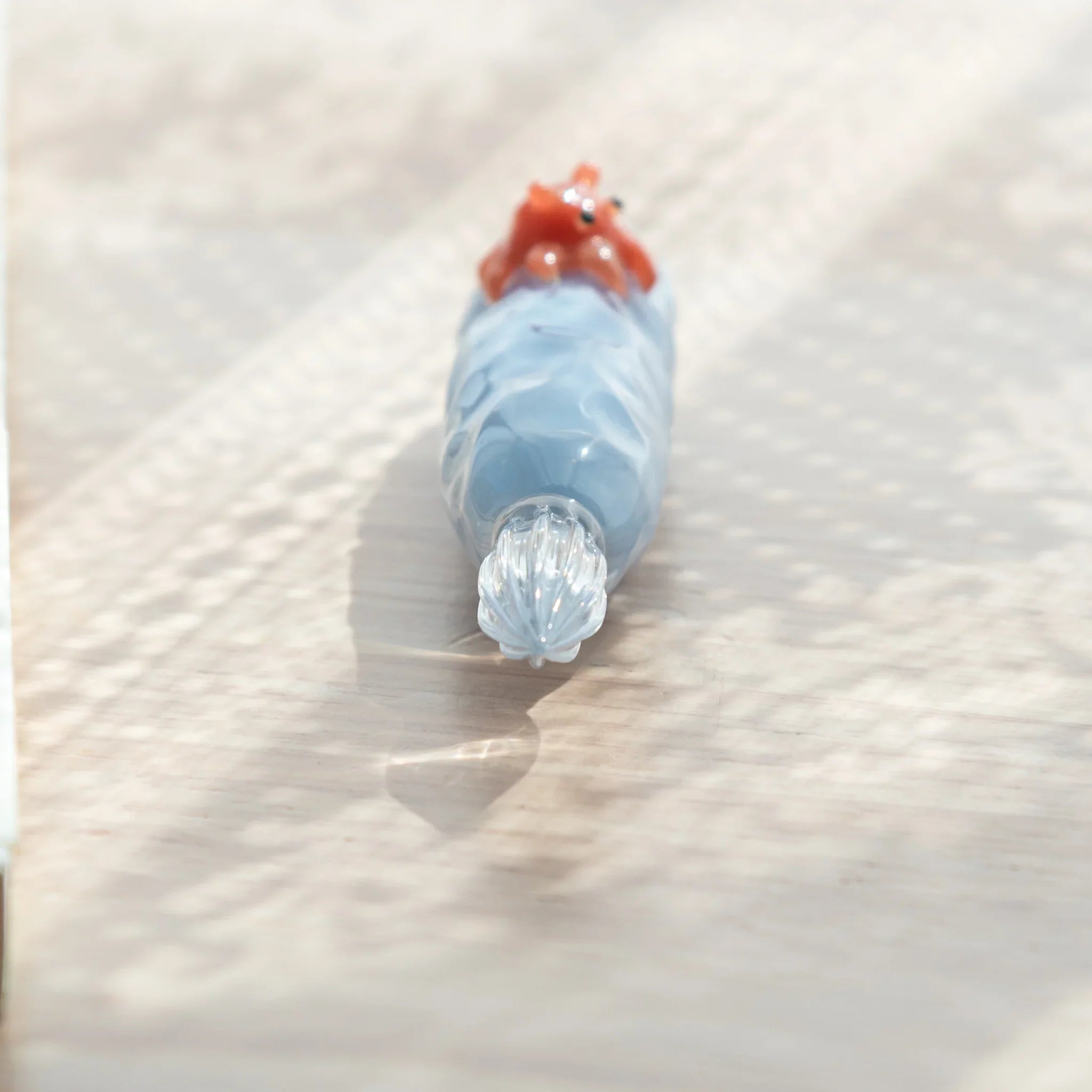 dip pen with detailed resin work showcasing dumbo octopus with distinctive ear-like fins on