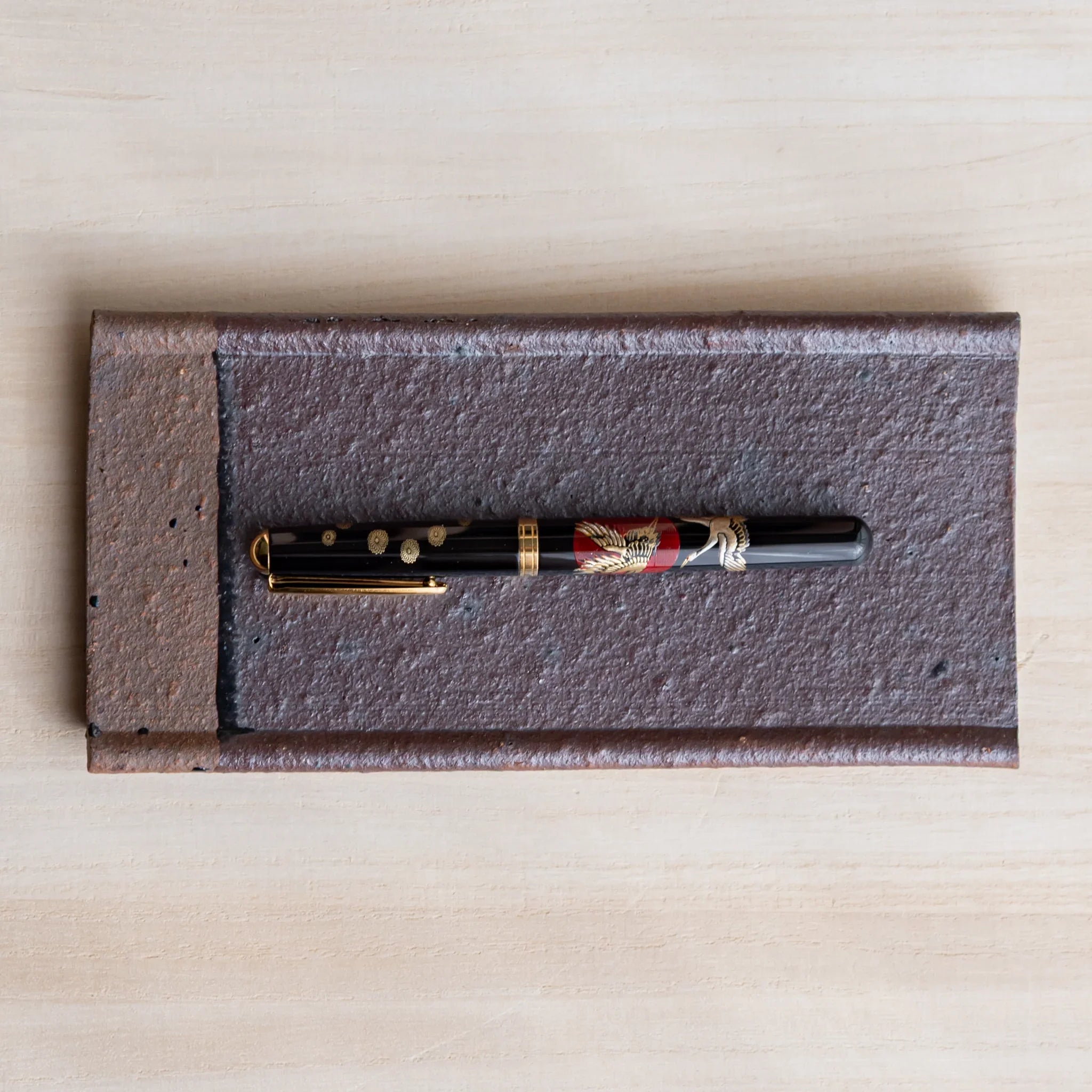 Echizen Kawara red tile ceramic pen tray with four slots shown in composition detail displayed in composition