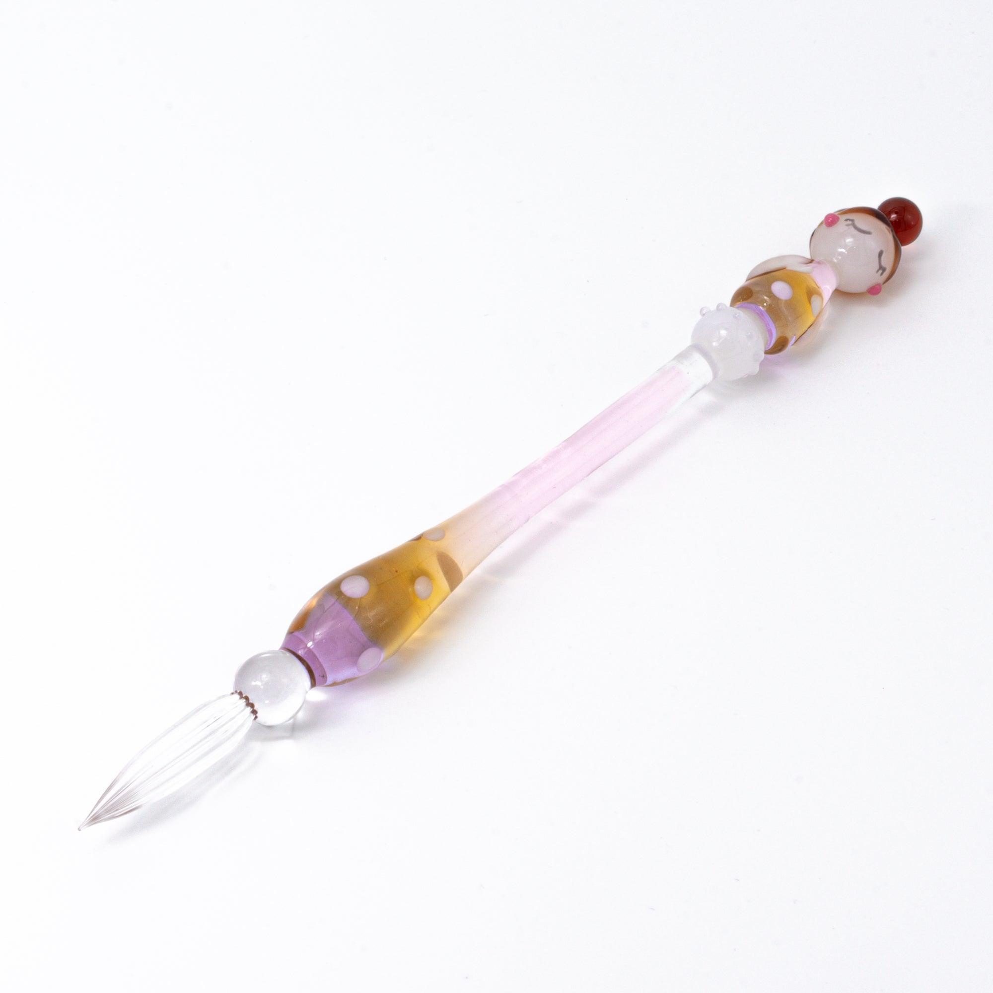 Marun-chan glass pen with a polka dot pattern in warm hues of purple and amber. The elegant pen is showcased against a white background