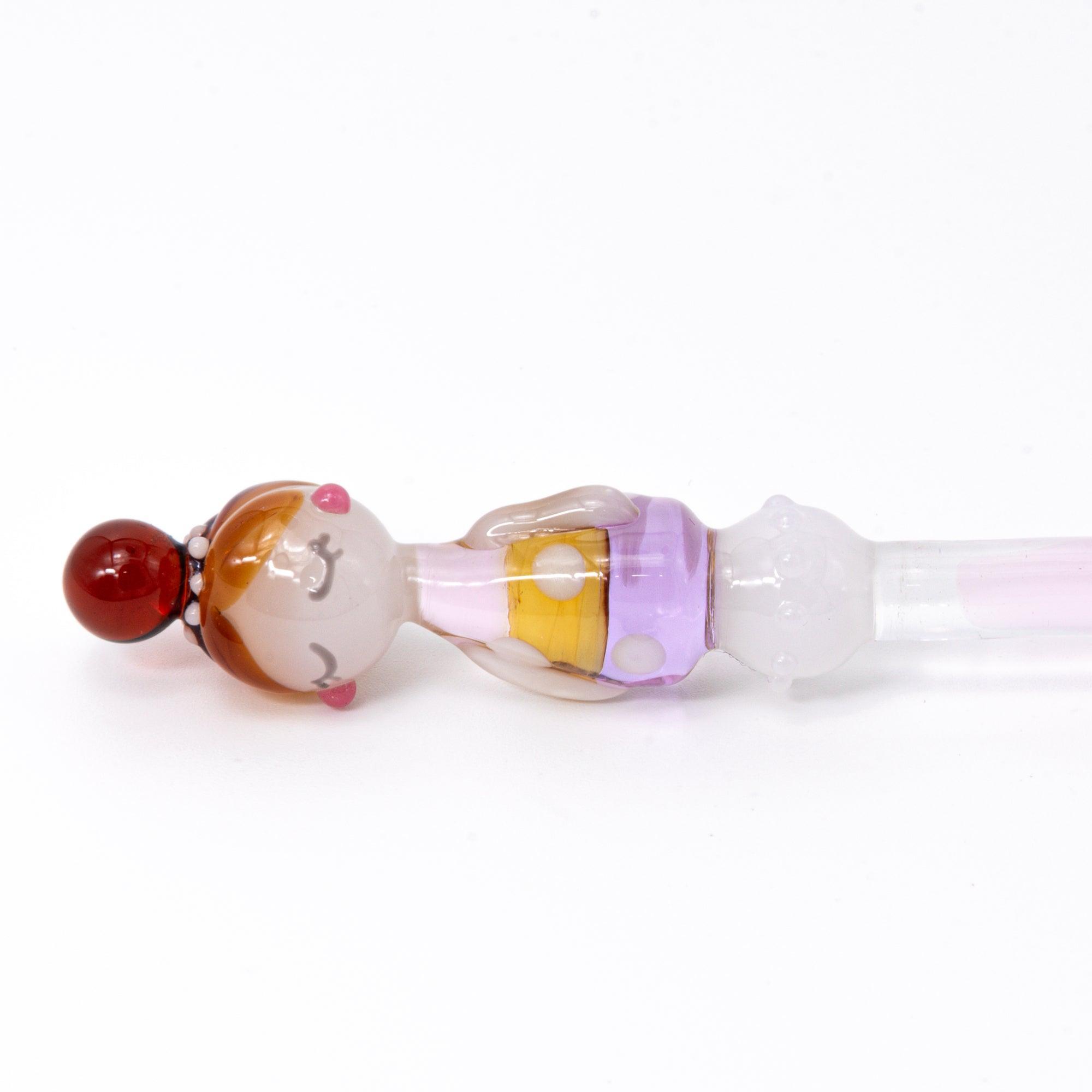Marun-chan glass pen with a polka dot pattern in warm hues of purple and amber. The elegant pen is showcased against a white background