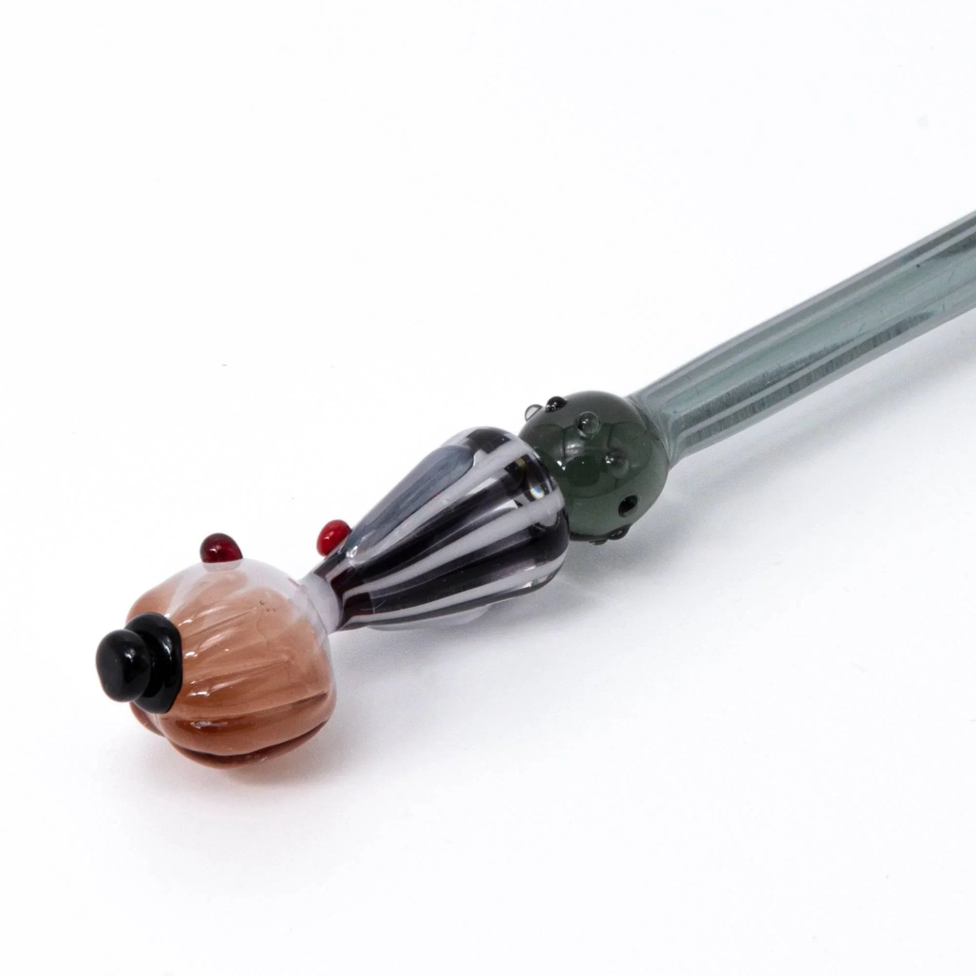 Moga-Chan striped glass pen showing character figure and vertical gray and black glass pattern with handle detail and