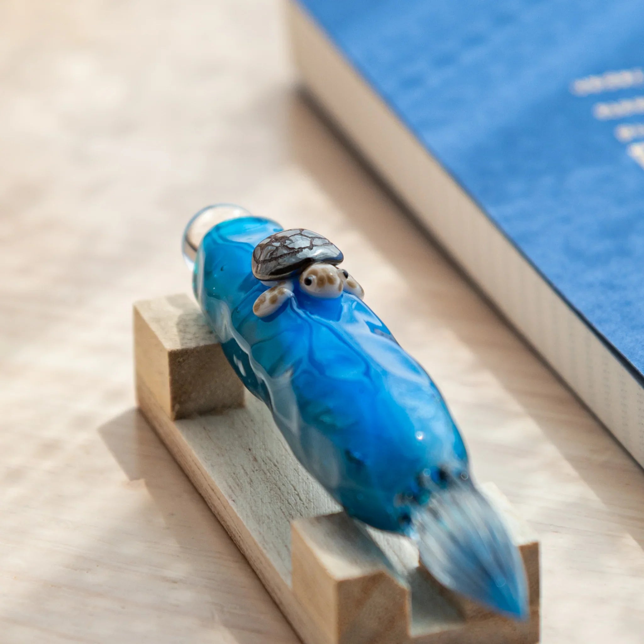 Floating turtle glass dip pen showing enclosed decorative figure inside clear barrel, hand-made Japanese stationery