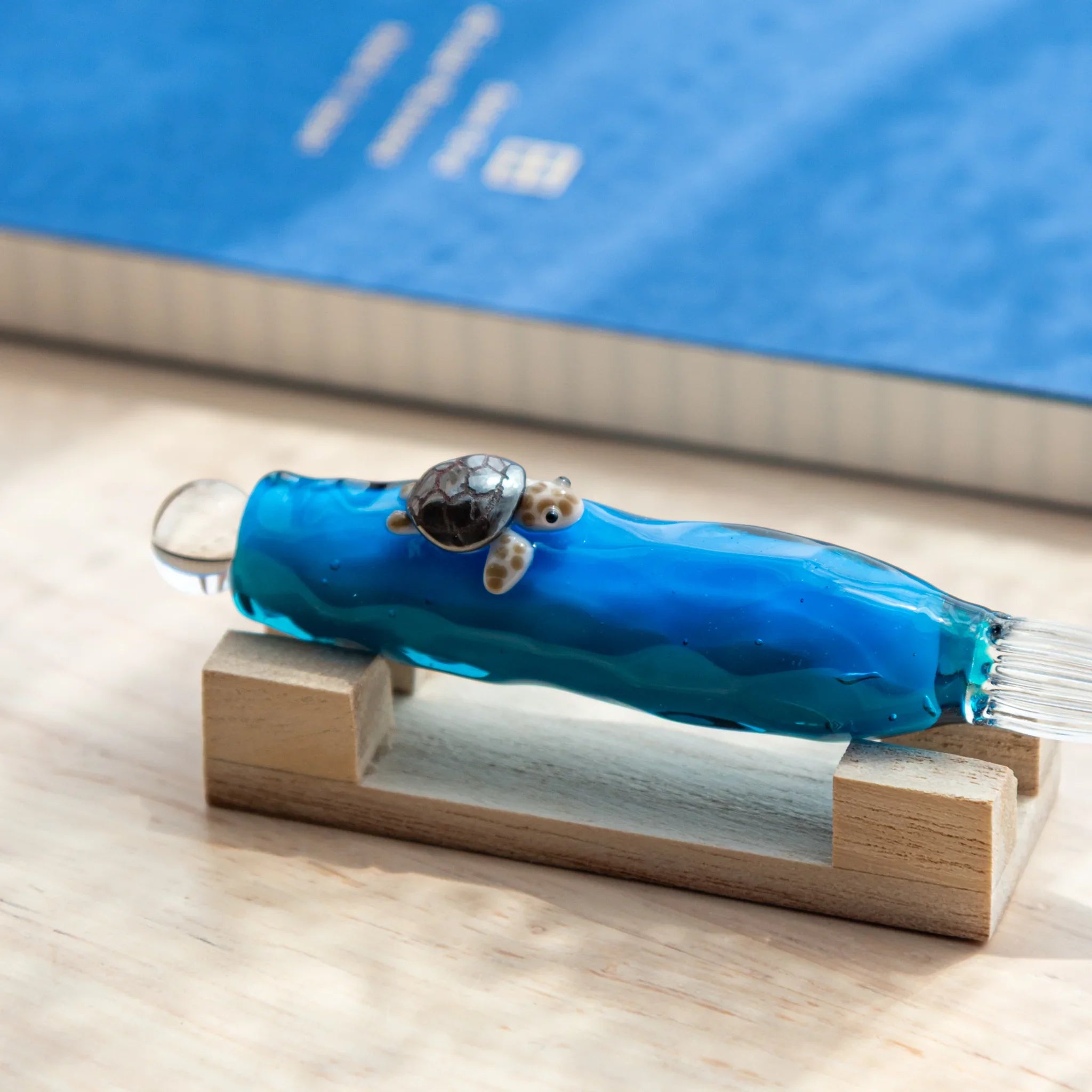 Floating Sea Turtle Japanese Glass Dip Pen with intricate turtle sculpture and textured blue ocean glass.