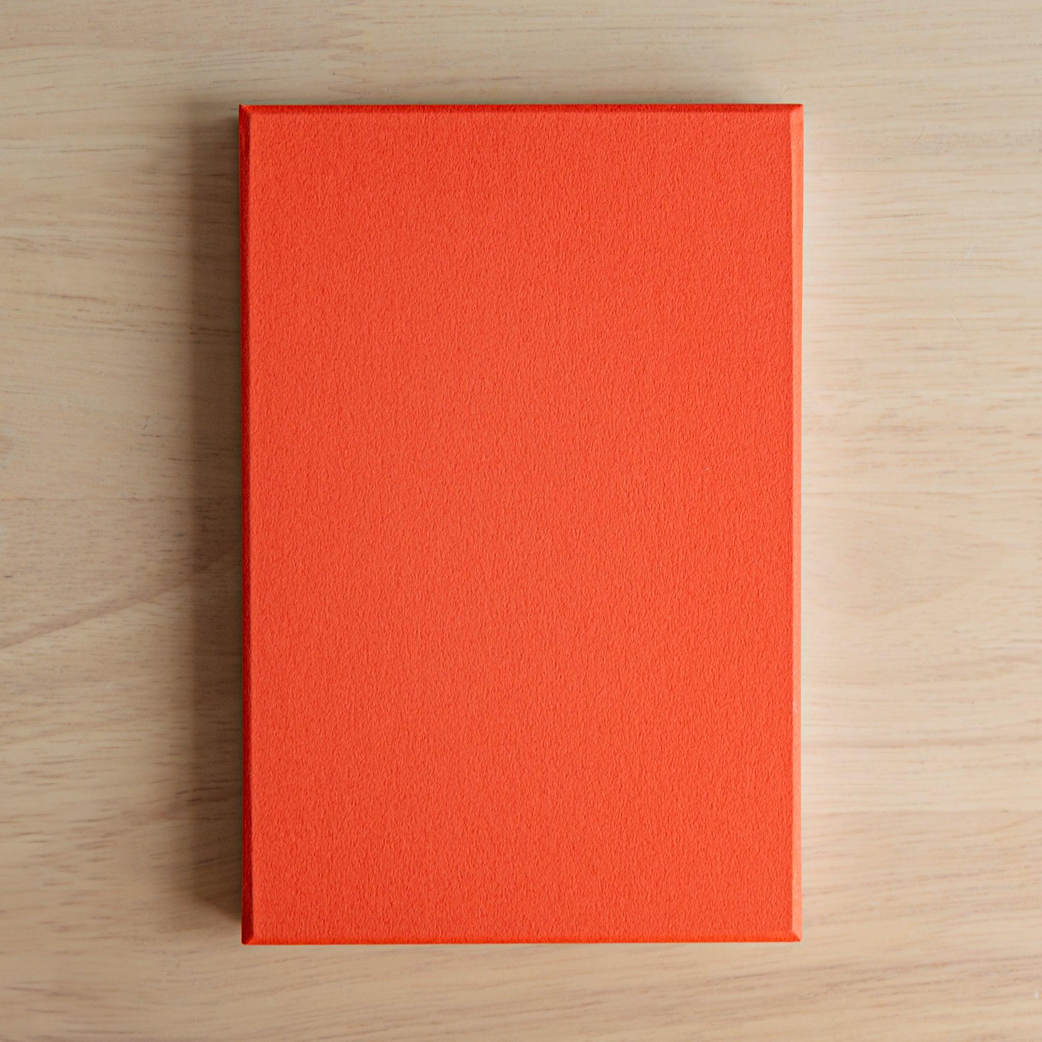 Floral Goshuinsho stamp book with gold accents and red washi-style cover, paired with matching pen, Japanese stationery.