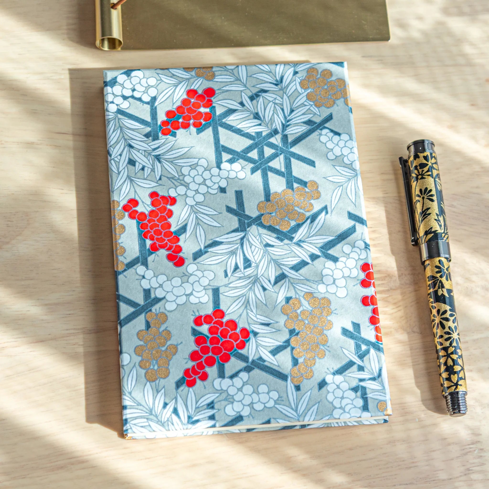 Fortune Nandina Washi Goshuincho stamp book with blue washi cover and red white nandina berry pattern