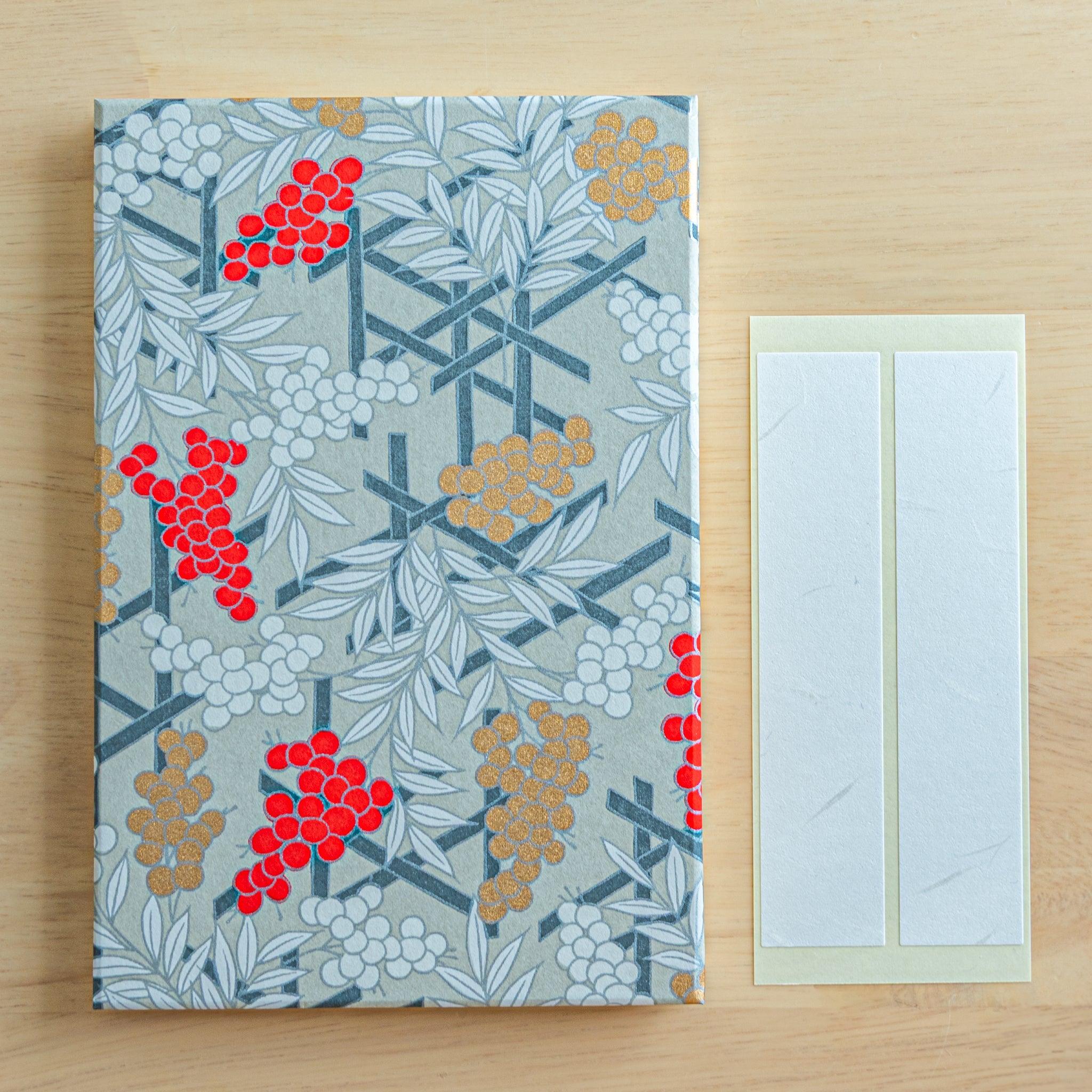 Goshuincho stamp book with red, white, and gold berries on gray, comes with blank name labels for shrine stamp collecting use