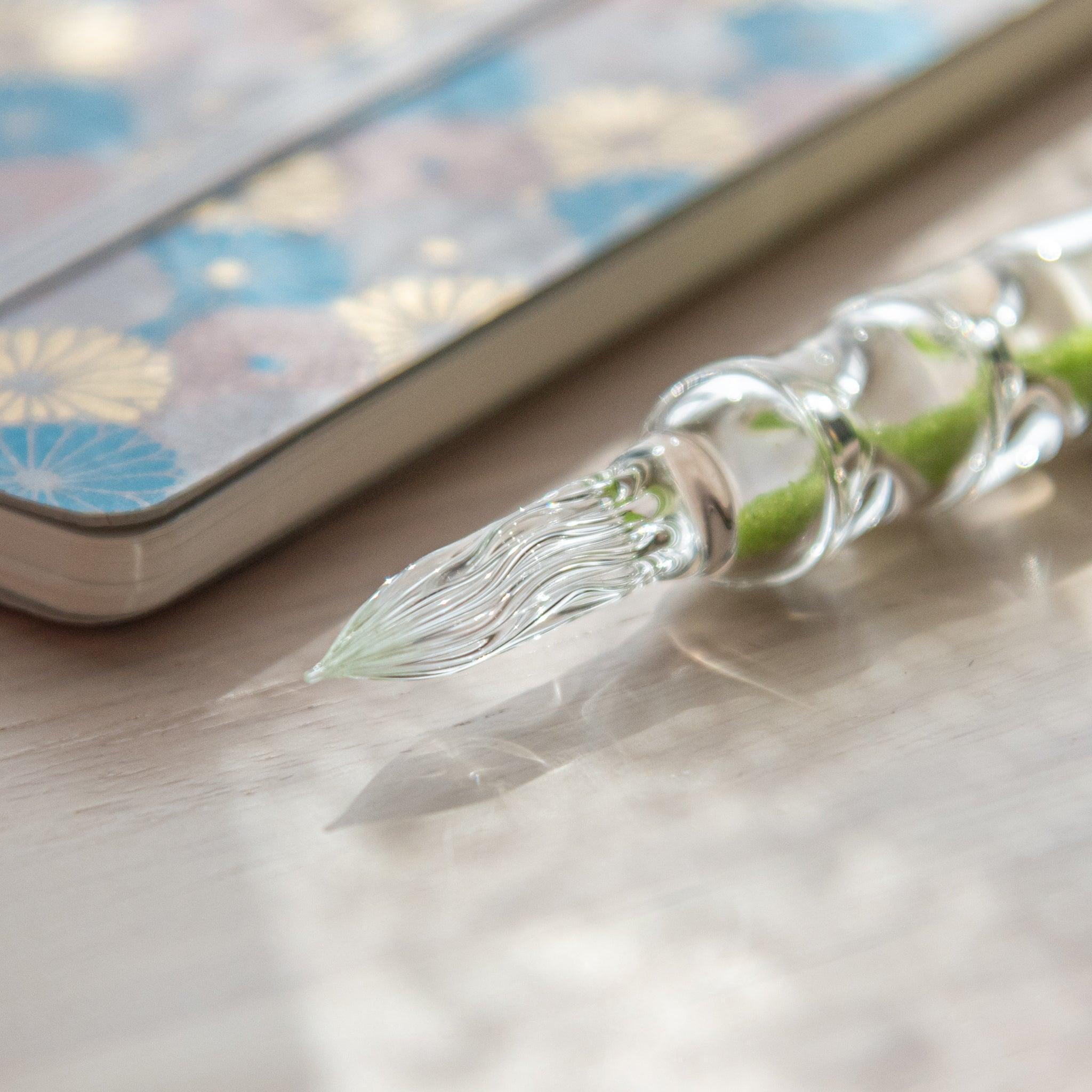 Fresh Green Hourglass Glass Dip Pen angled view showing bright green pigmented bulbs in clear glass hourglass design