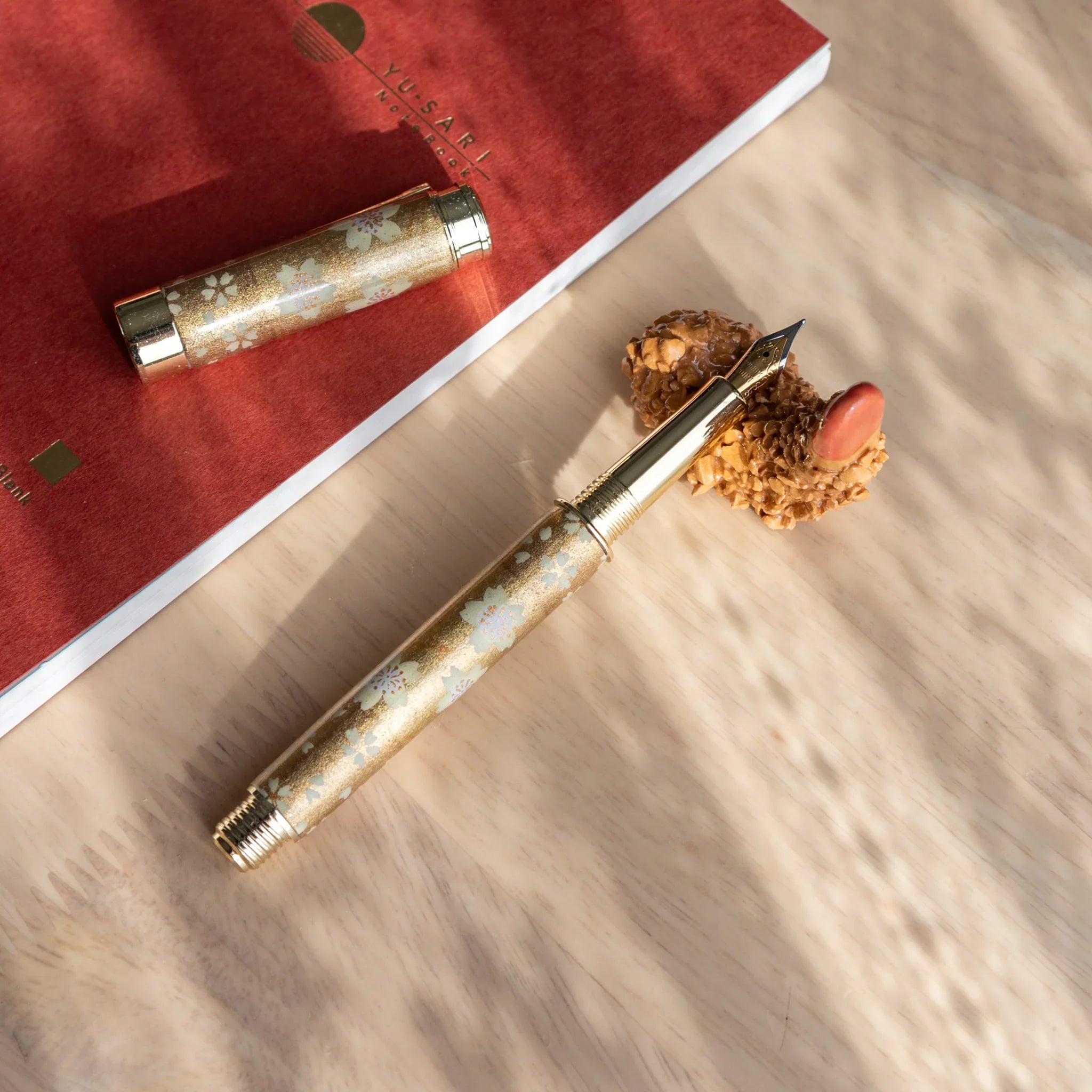 Curved orange fried tempura shrimp pen rest with realistic bumpy textured surface and curved organic food shape styling