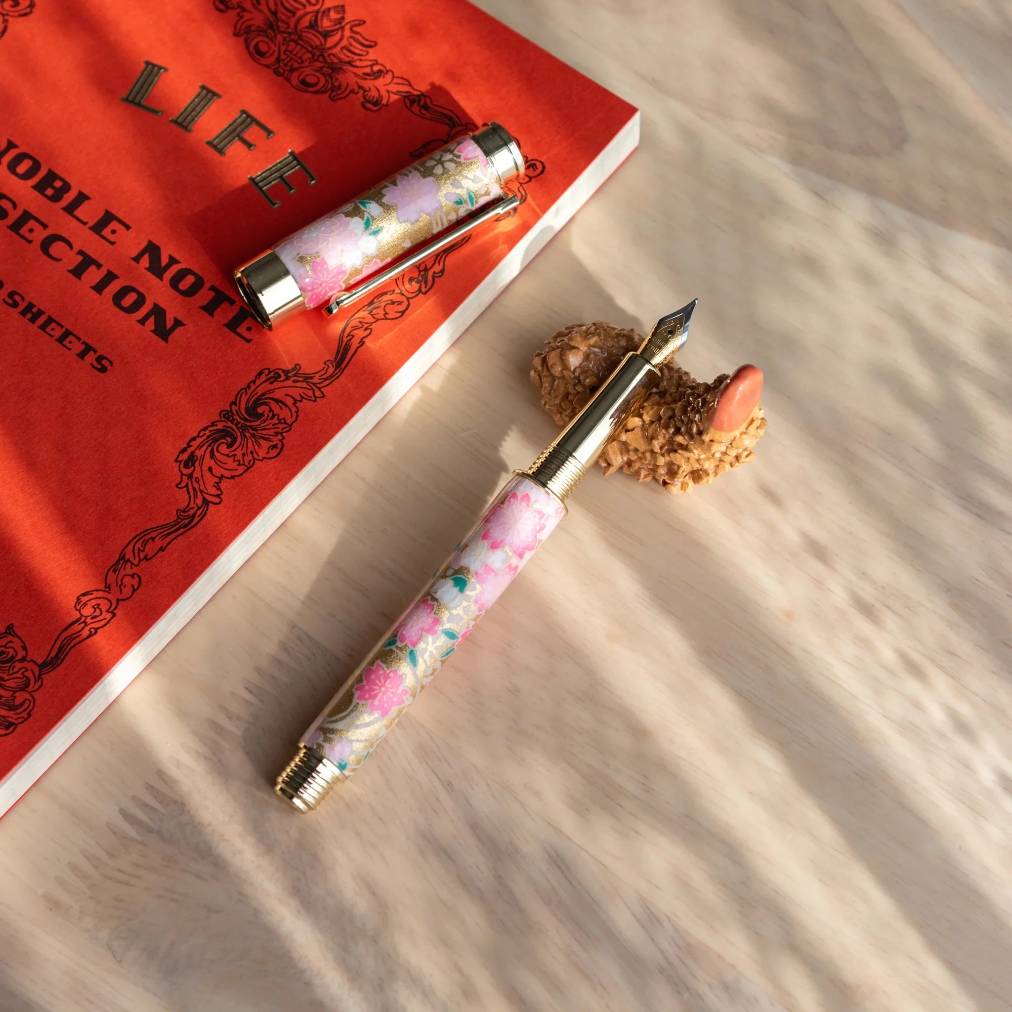 Orange toned fried shrimp pen rest with curved form showing realistic bumpy food surface simulation and authentic detail