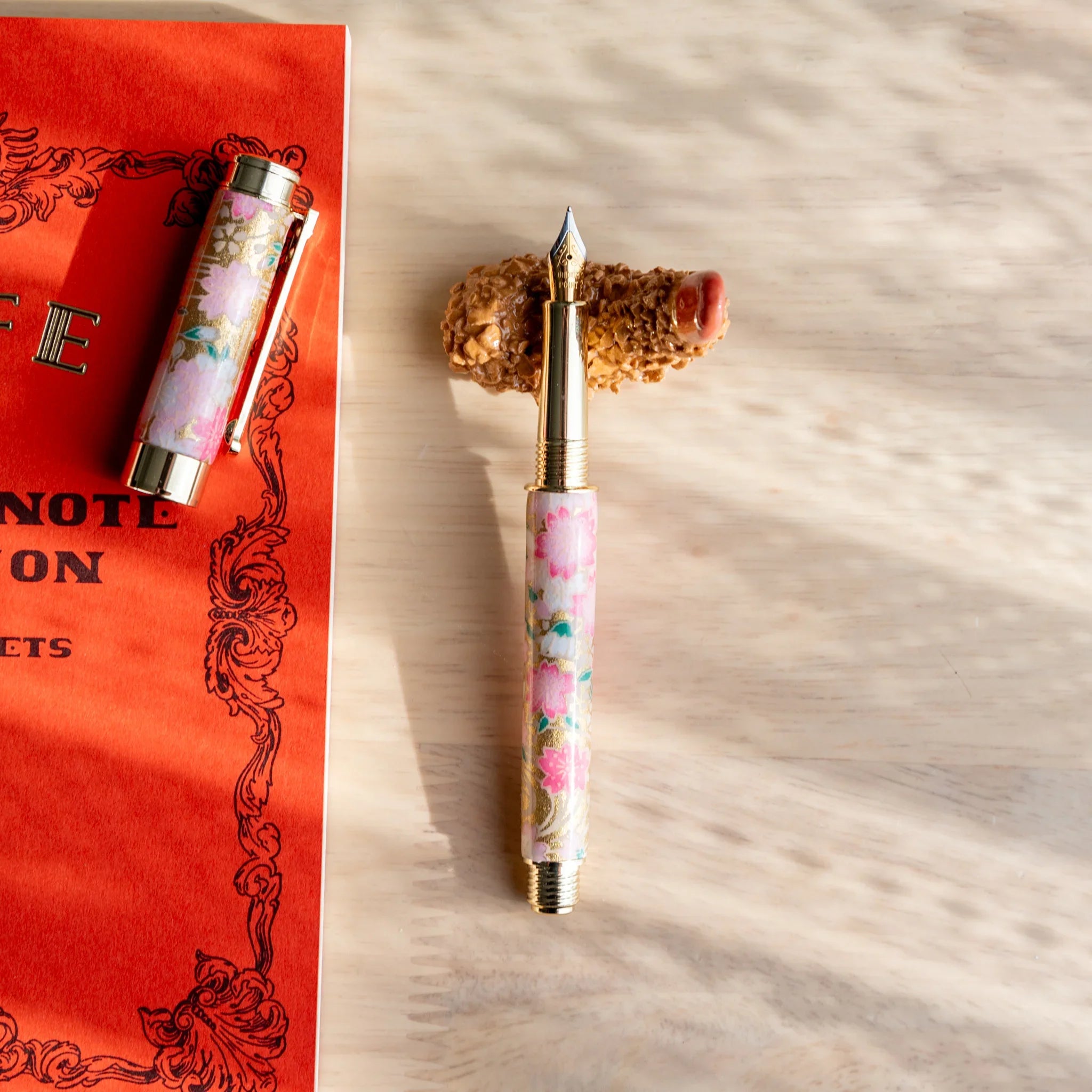 Fried shrimp handcrafted pen rest in orange with textured bumpy surface showing authentic detailed Japanese food design style