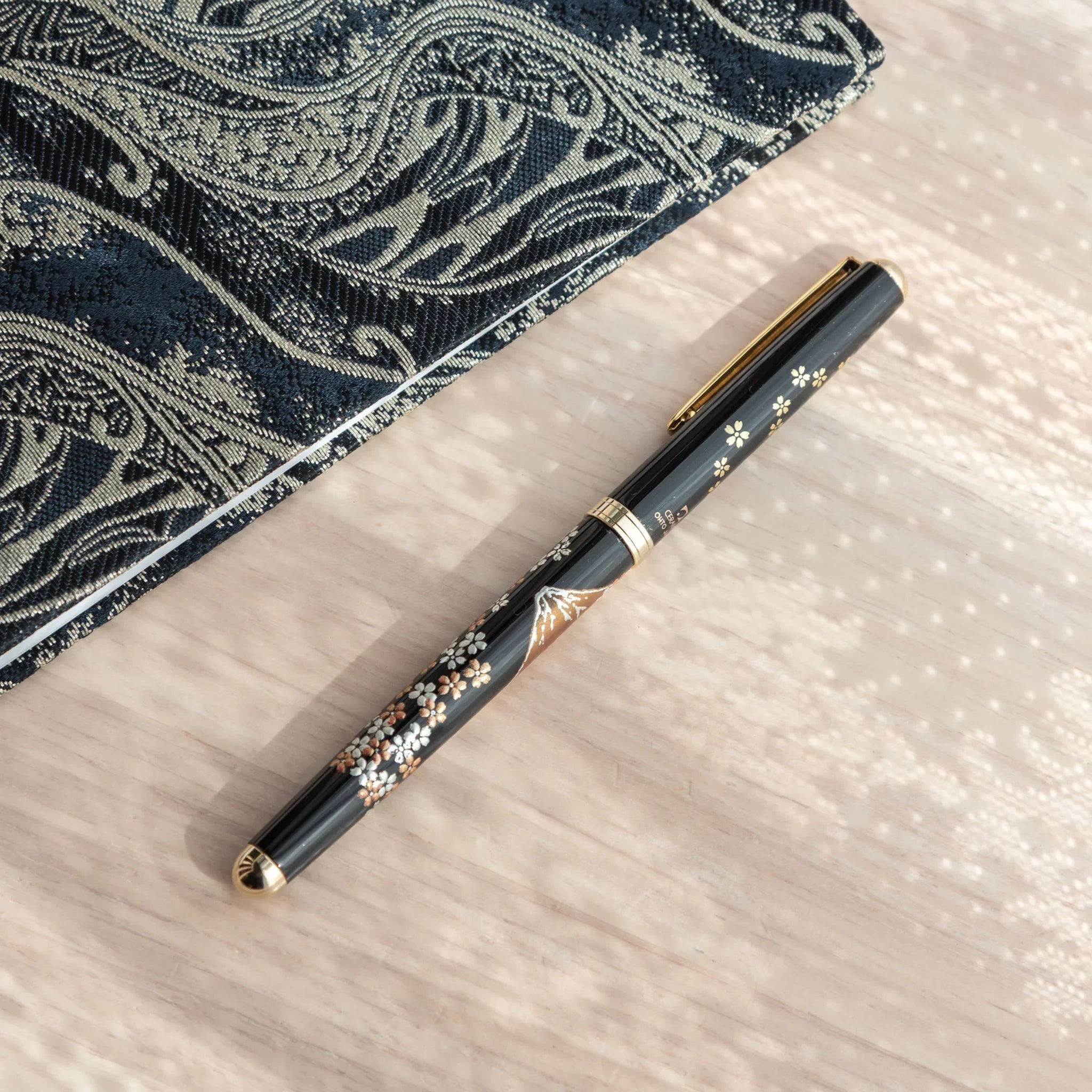 Fuji Sakura Yamanaka ballpoint pen displays hand-painted lacquer cherry blossom and Mount Fuji composition