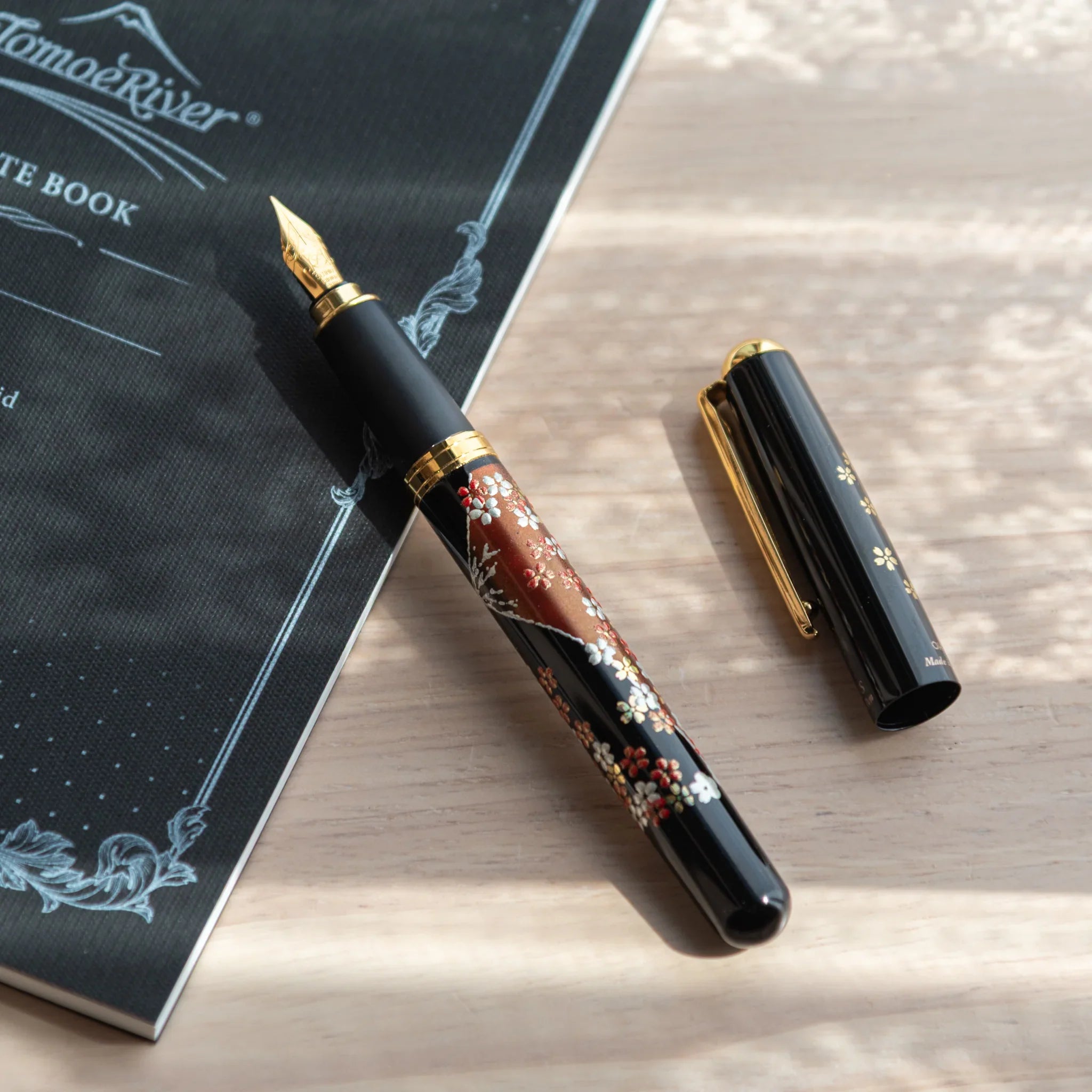 Japanese Yamanaka lacquer fountain pen features Mount Fuji and sakura cherry blossom artwork for writing