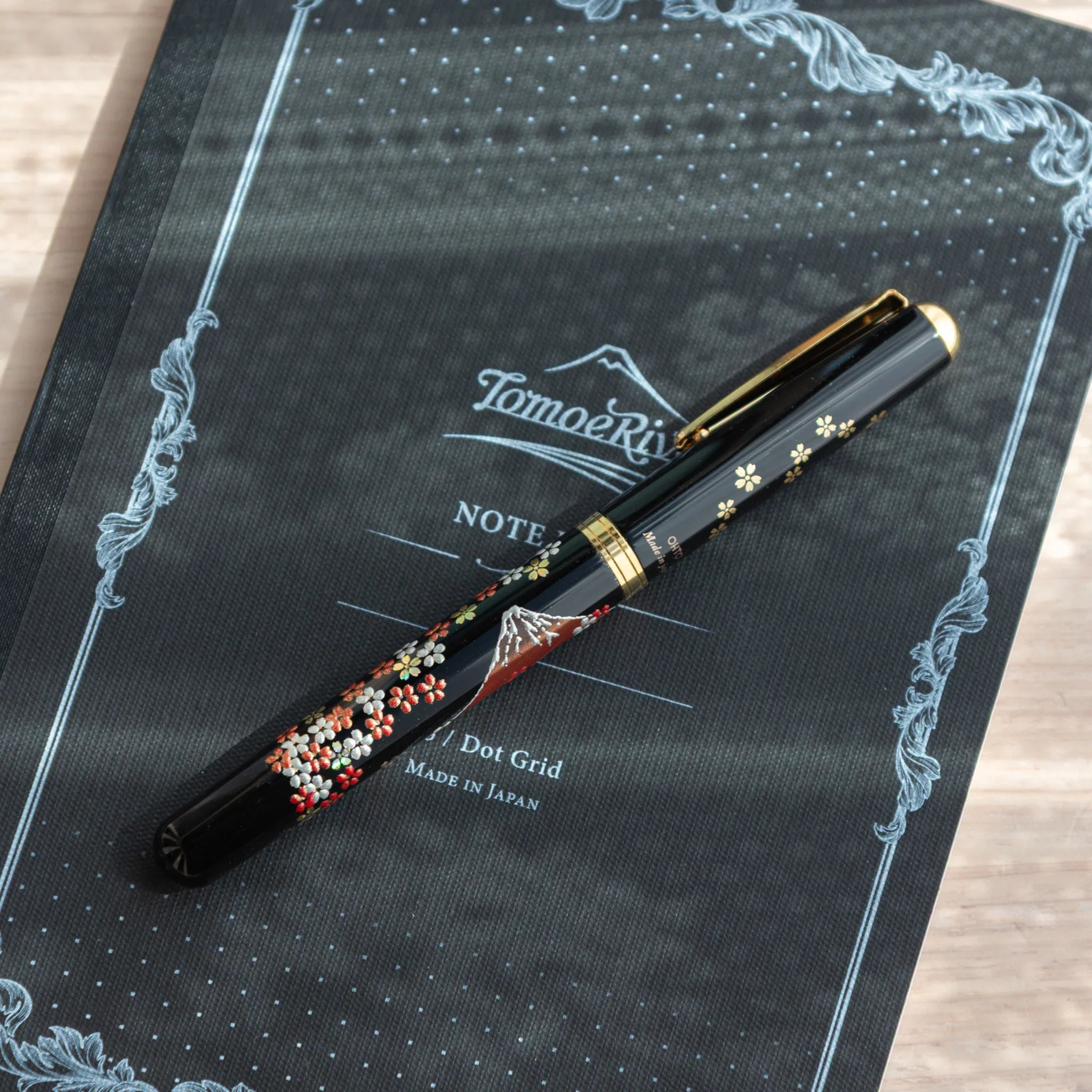 Hand-turned Yamanaka wooden fountain pen features fuji and sakura landscape lacquer art design for writing