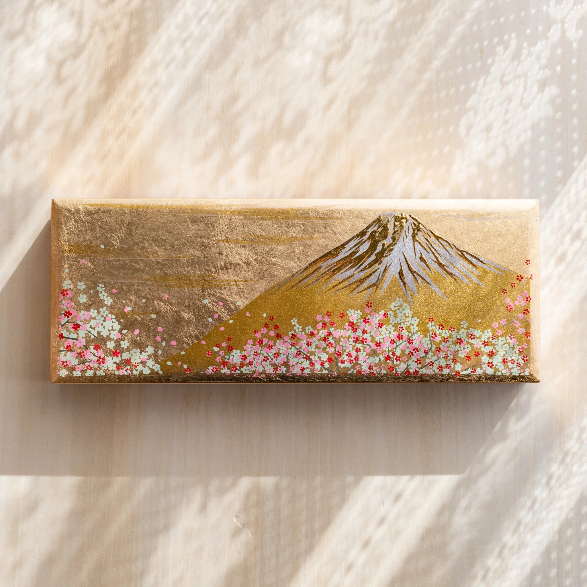 Fuji Sakura Yamanaka pen case with gold exterior finish and Mt. Fuji with cherry blossoms displayed clearly