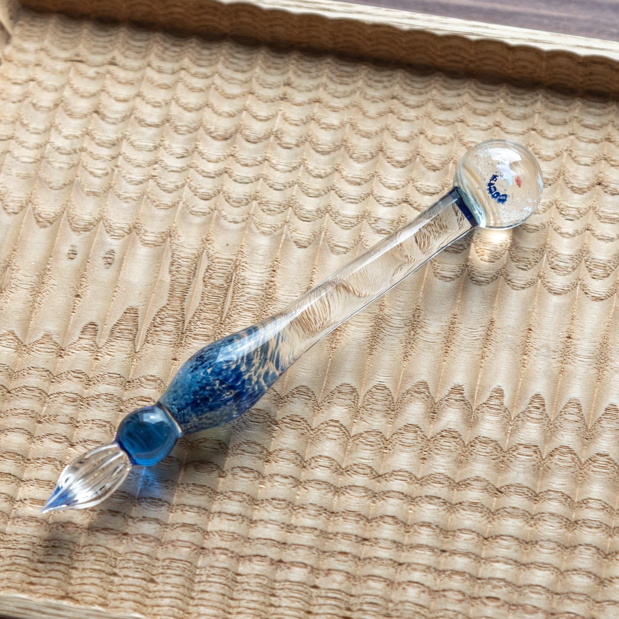Galaxy express glass dip pen with cosmic pattern motif showing celestial stars and space design element in frame