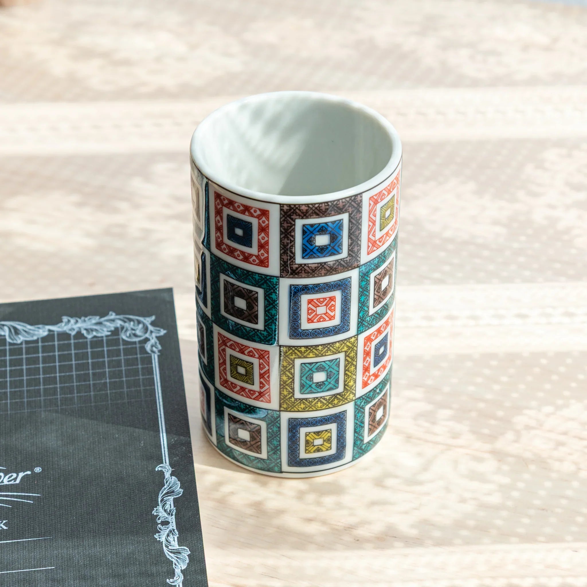 Decorative Kutani ceramic pen holder with intricate geometric tile pattern for desk storage featuring traditional