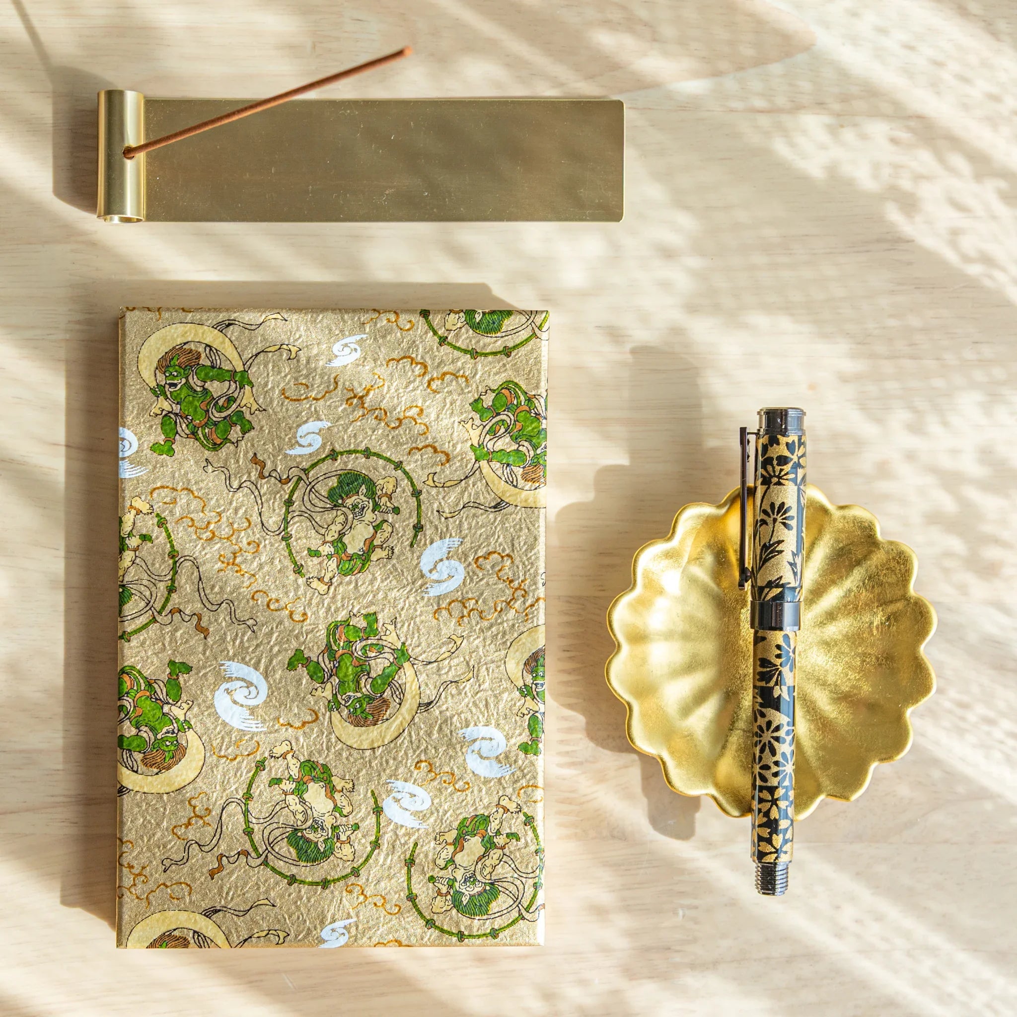 Wind and Thunder stamp book with deity motif clearly visible on washi cover design with hand-dyed finish