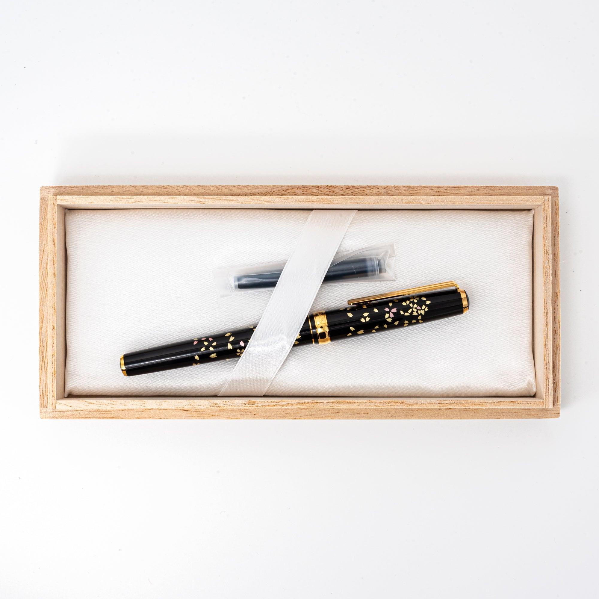 Detailed barrel view Gold Leaf Sakura Makie fountain pen with scattered gold-leaf cherry blossom inlay
