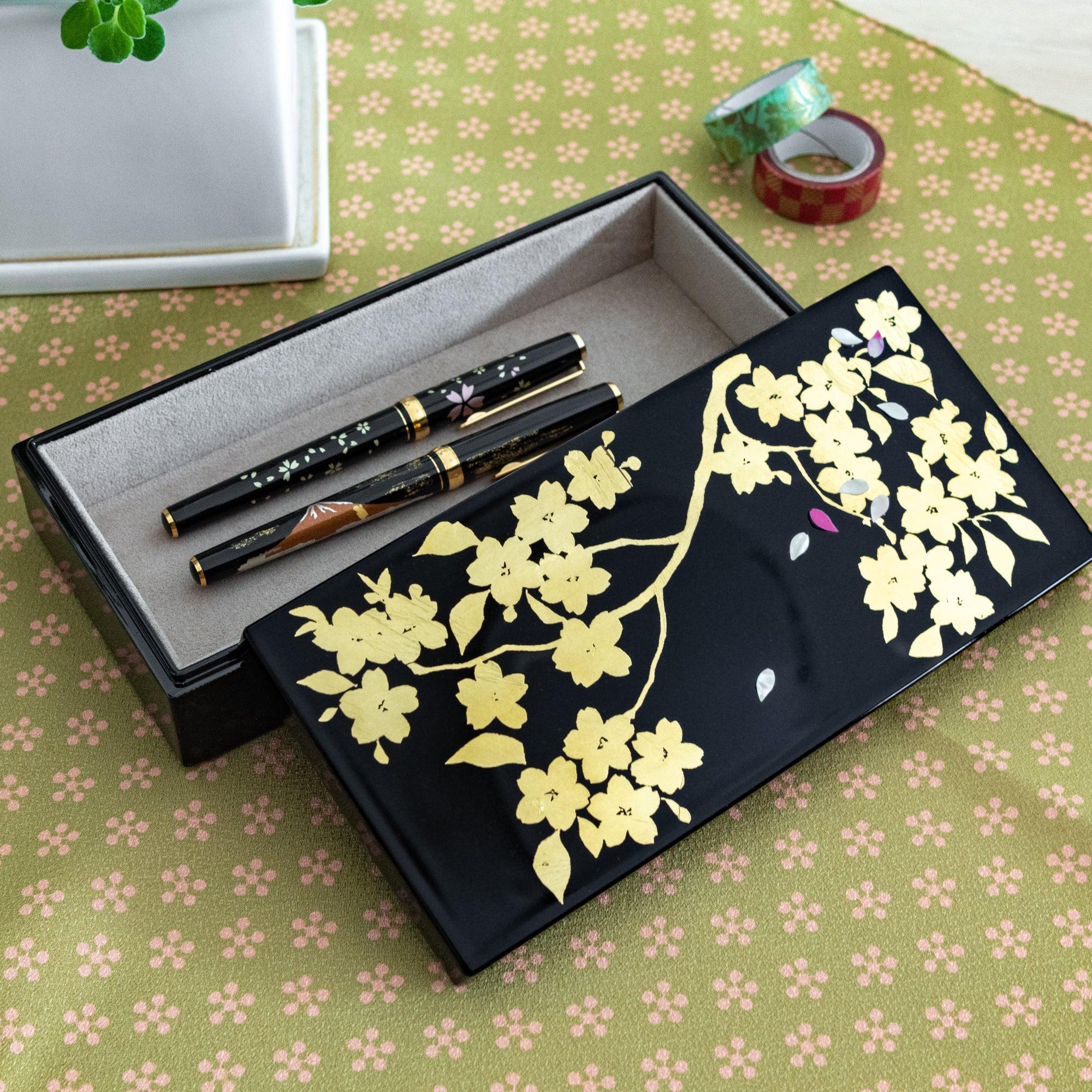 Gold Leaf Sakura pen box with decorative lid showing cherry blossom motif design displayed clearly composition