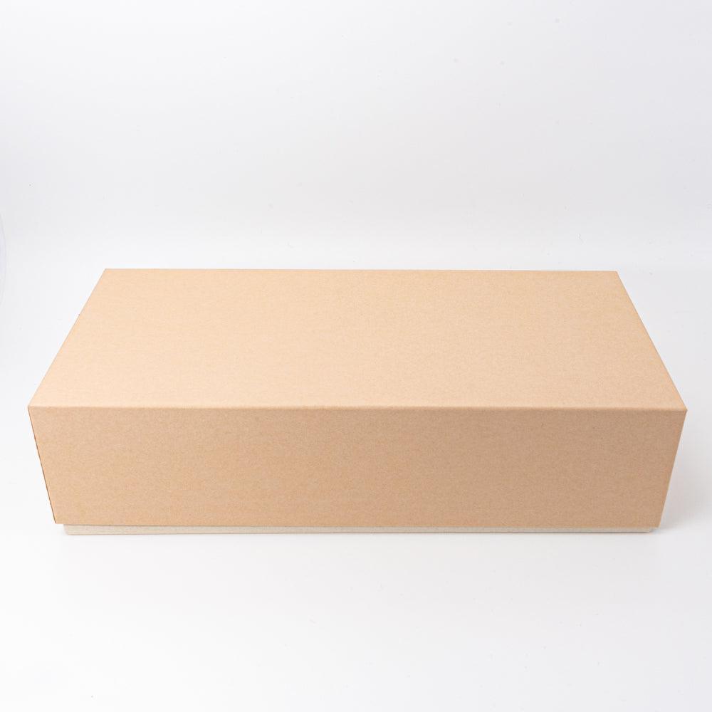 Minimalist brown outer box designed for safely packaging the lacquer pen case, highlighting simplicity and functionality in Japanese stationery.