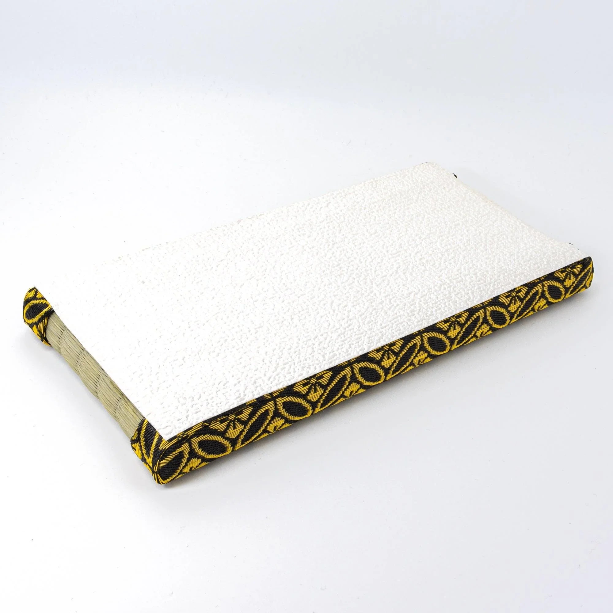 Close-up view of tatami straw weave quality with gold shippo pattern trim detail clearly visible area