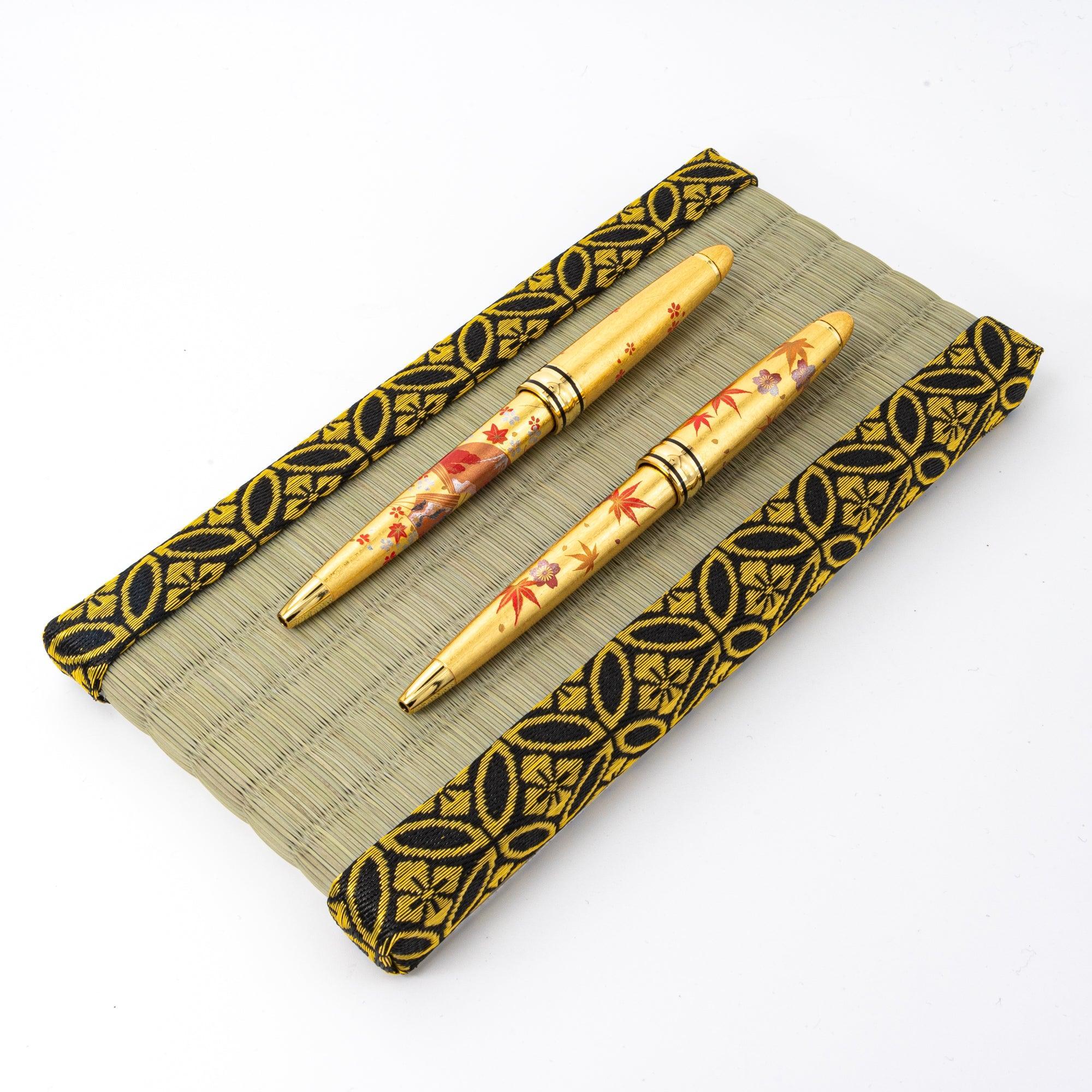 Pen tray interior showing light natural straw weave surface and gold shippo edge trim design detail area