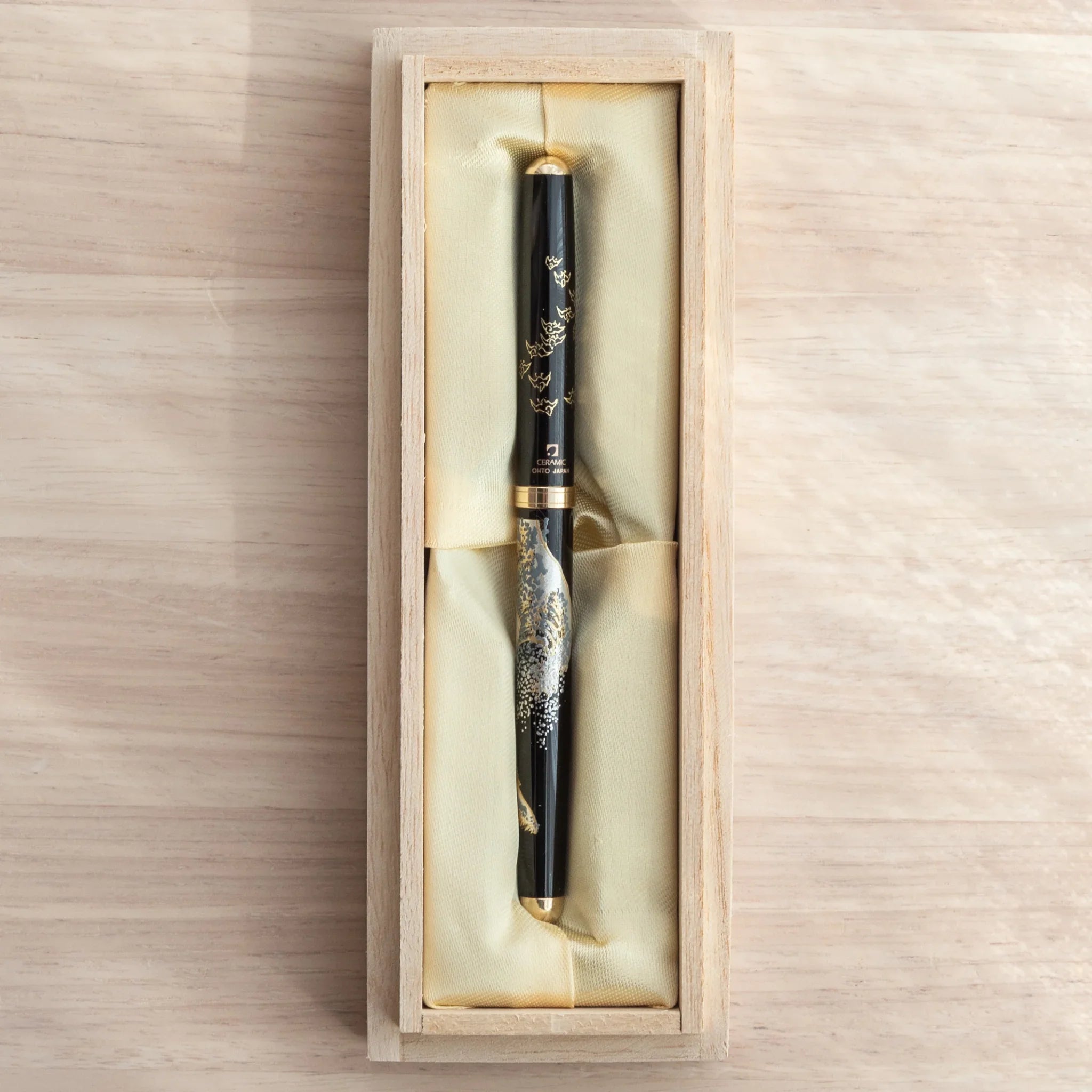 Japanese Ballpoint Pen featuring Hokusai's Great Wave in intricate Lacquer art, presented in a silk-lined gift box.