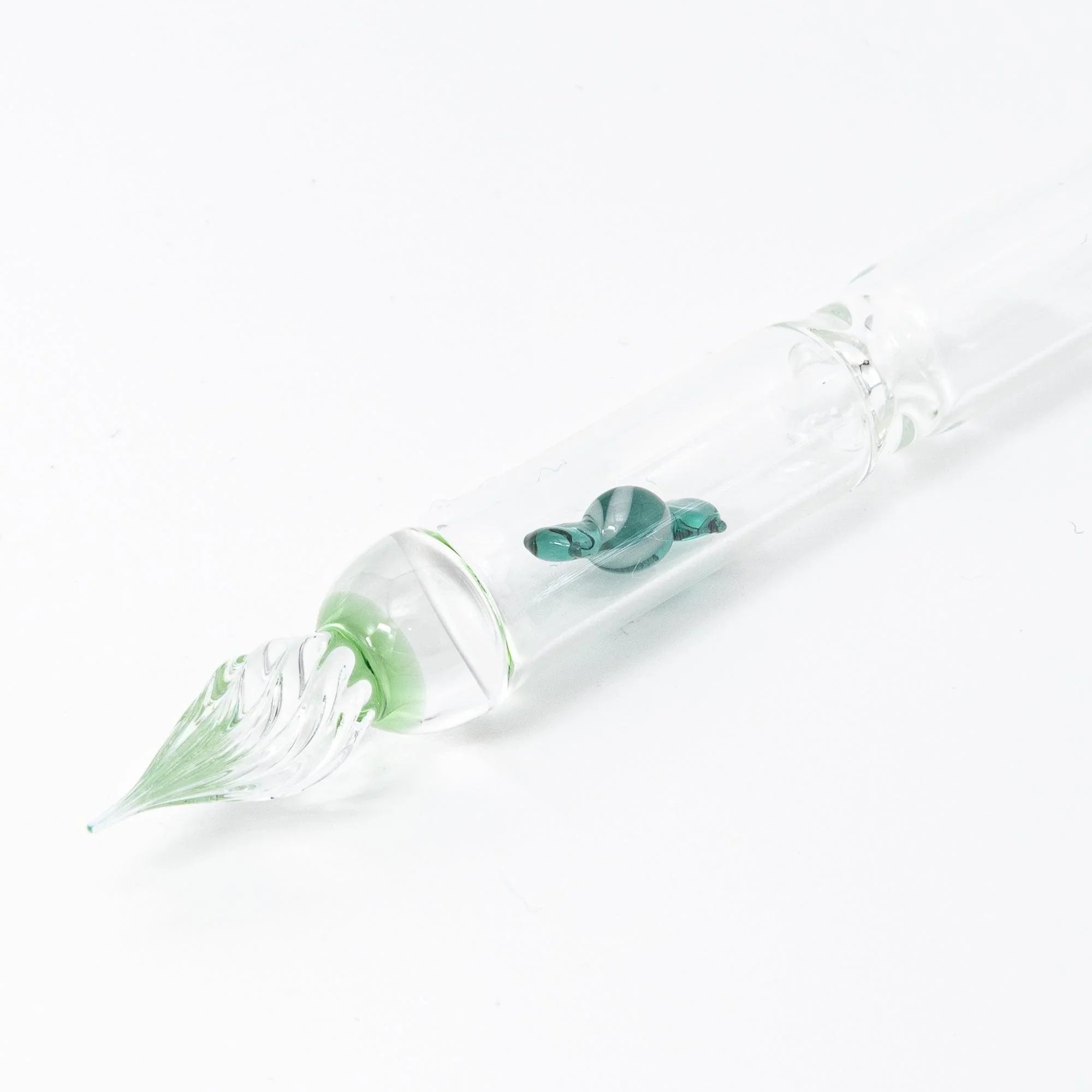 Green Candy glass dip pen in calligraphy use demonstrating smooth ink flow with captured candy design with holder