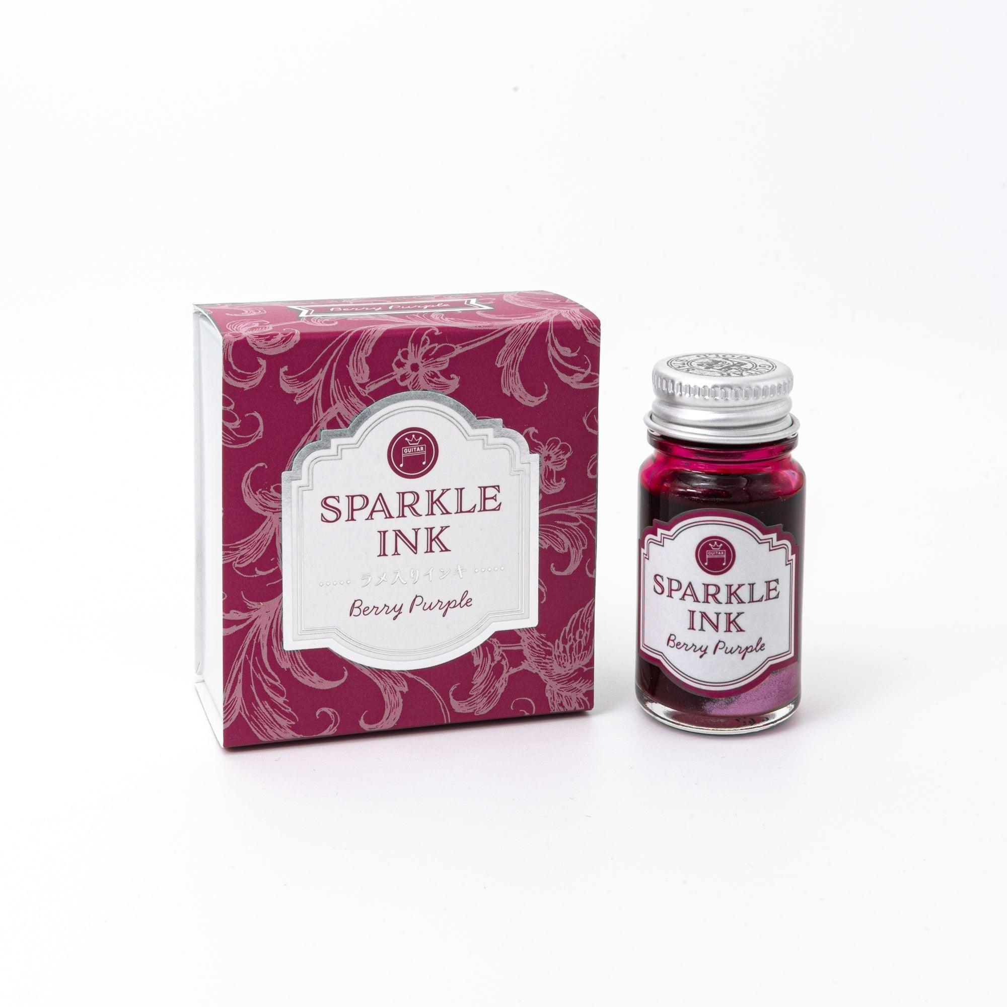 Sparkle Ink in Berry Purple, displayed in a glass bottle with matching berry-colored packaging featuring floral patterns and elegant lettering.