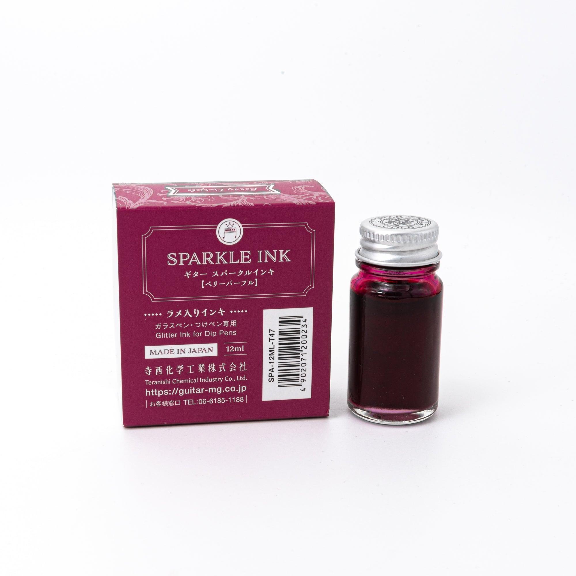 Sparkle Ink in Berry Purple, displayed in a glass bottle with matching berry-colored packaging featuring floral patterns and elegant lettering.