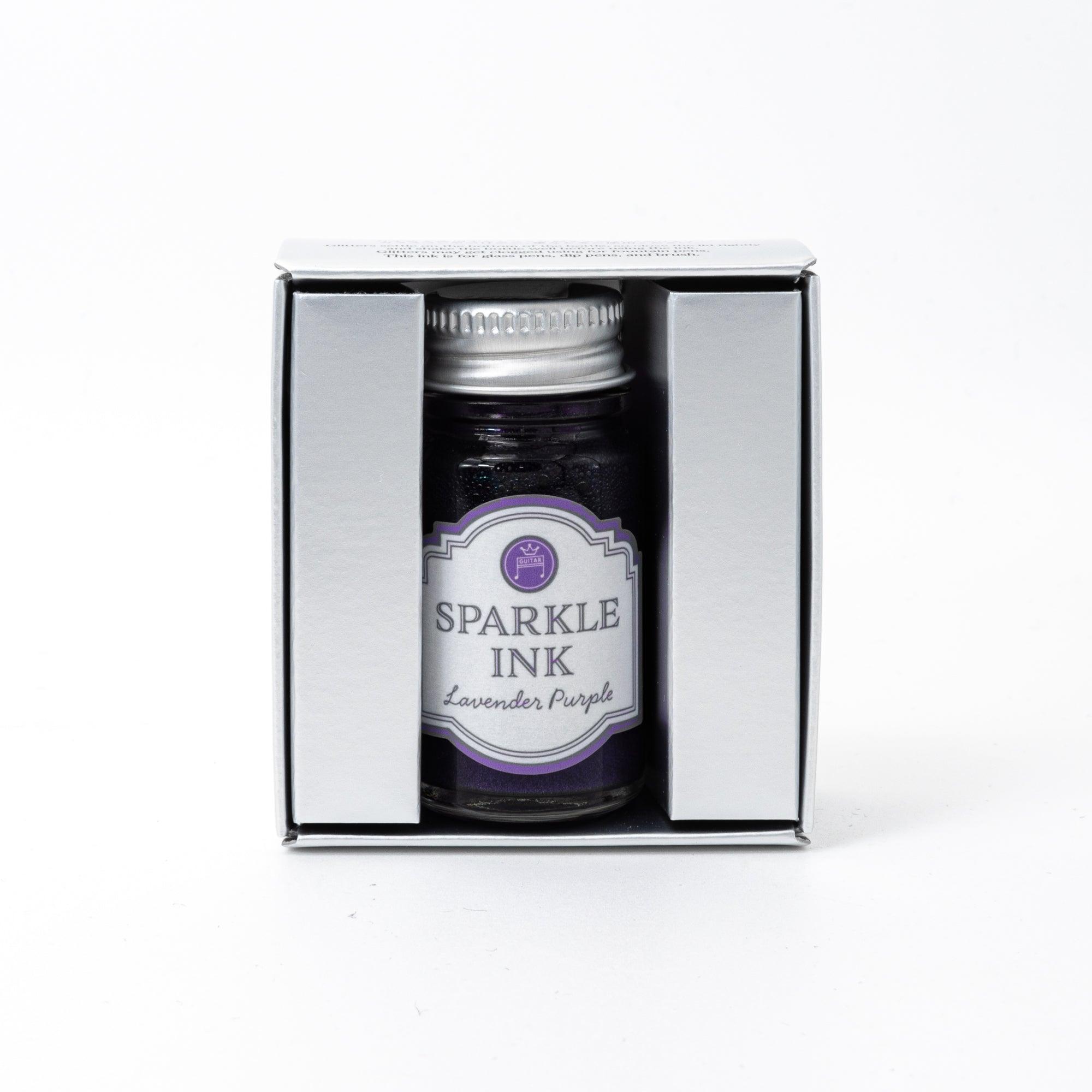 Sparkle Ink in Lavender Purple, presented in a glass bottle with a matching purple box featuring elegant floral motifs and refined typography.