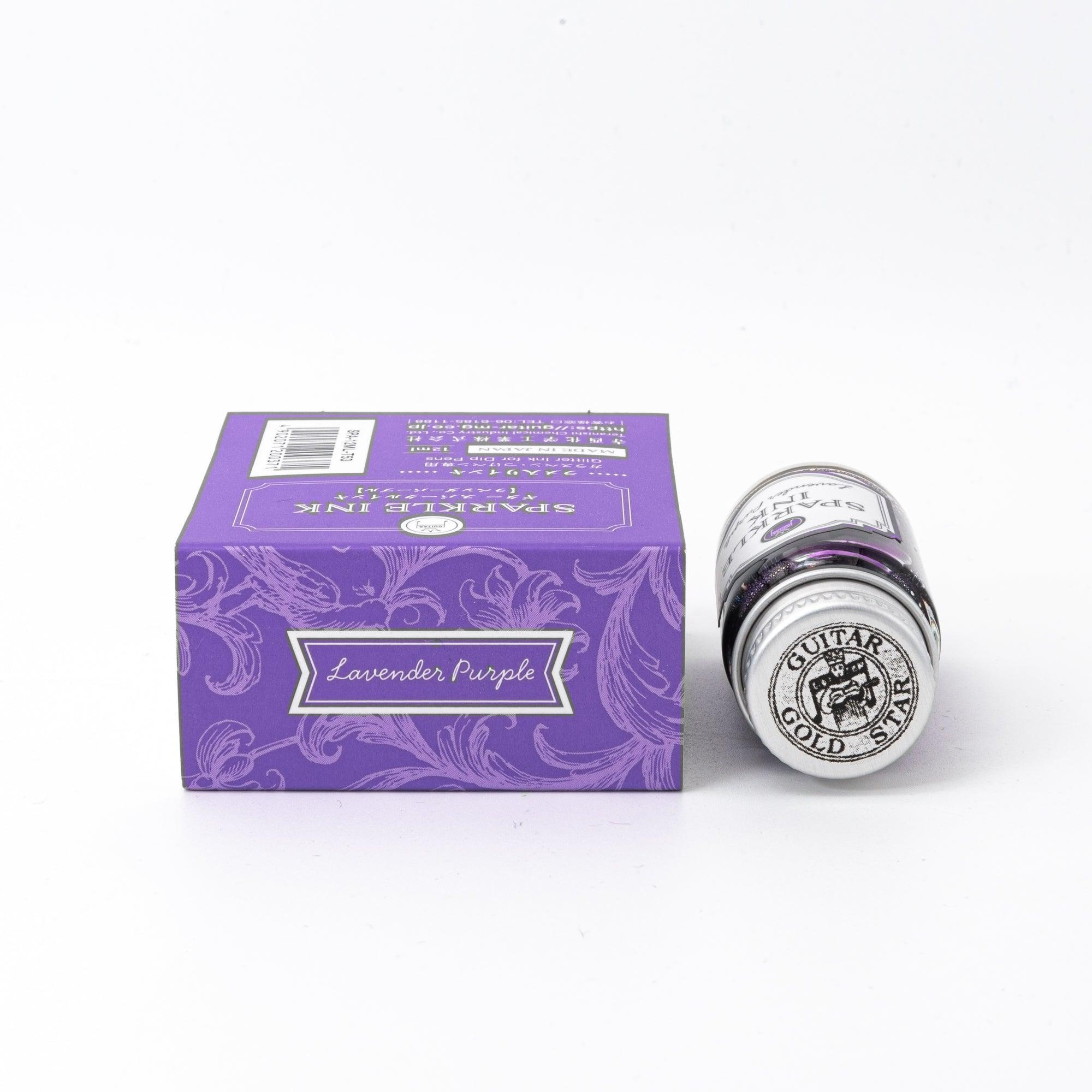 Sparkle Ink in Lavender Purple, presented in a glass bottle with a matching purple box featuring elegant floral motifs and refined typography.