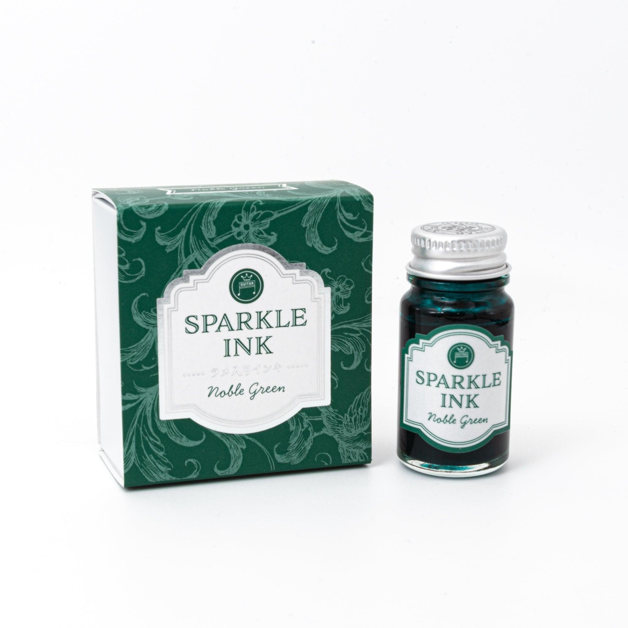 Sparkle Ink in Noble Green, presented in a glass bottle with elegant packaging adorned with floral patterns in matching green tones.